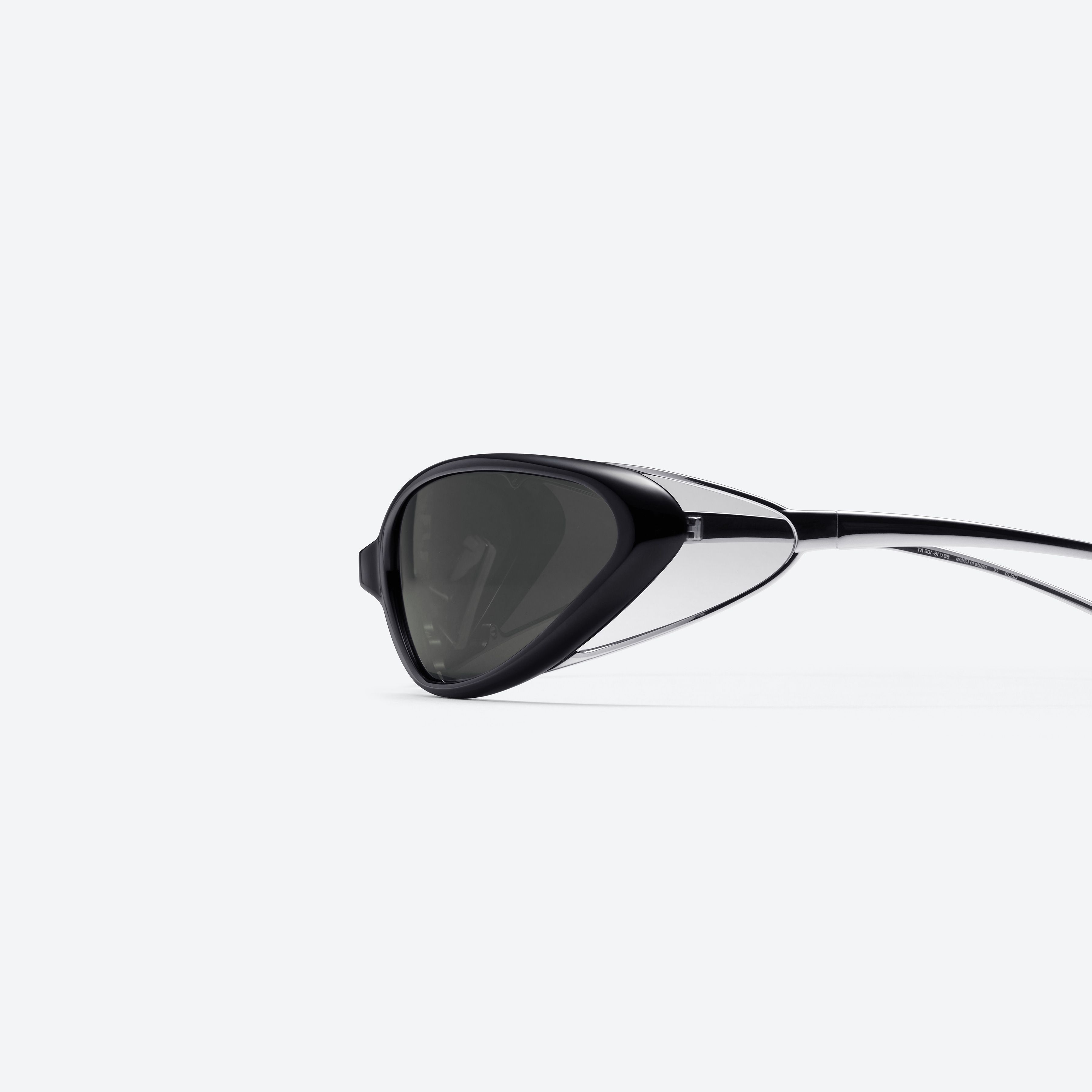 A detailed left view of Gentle Monster Noiz Veil 01 Black Nylon framed Wraparound sunglasses.