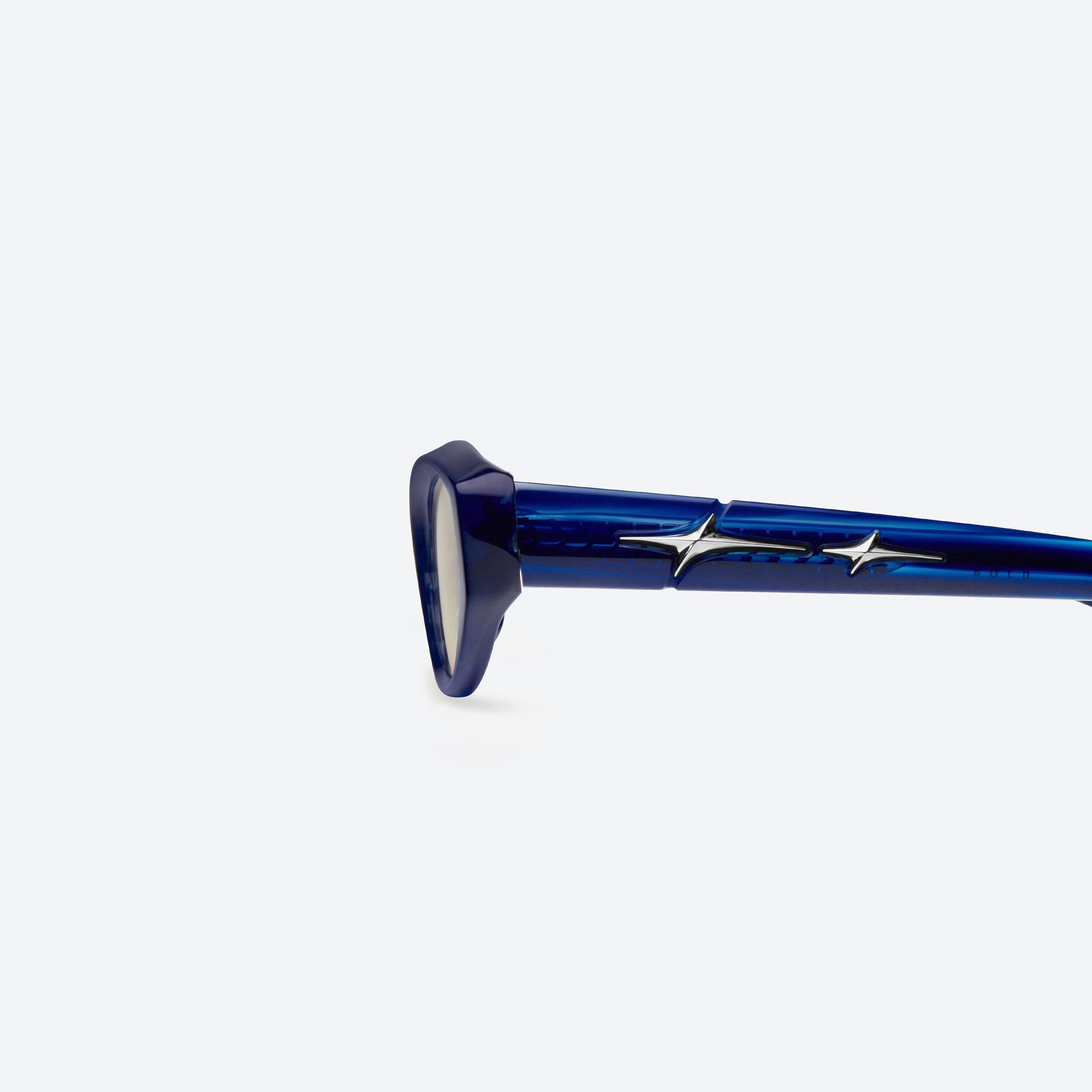 A detailed left view of Gentle Monster Synth BLD1 Blue Acetate framed Cat-eye sunglasses.
