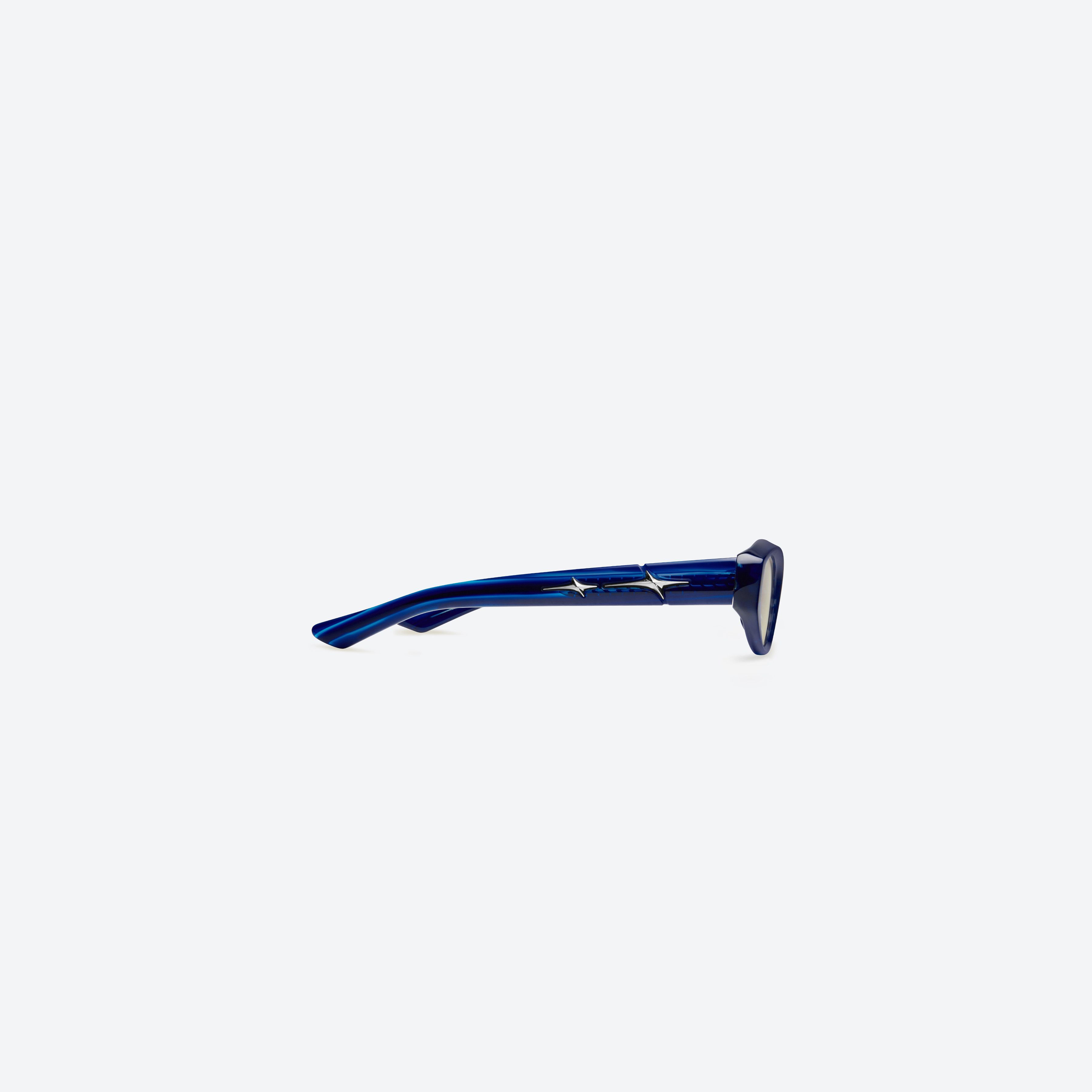 A detailed right view of Gentle Monster Synth BLD1 Blue Acetate framed Cat-eye sunglasses.