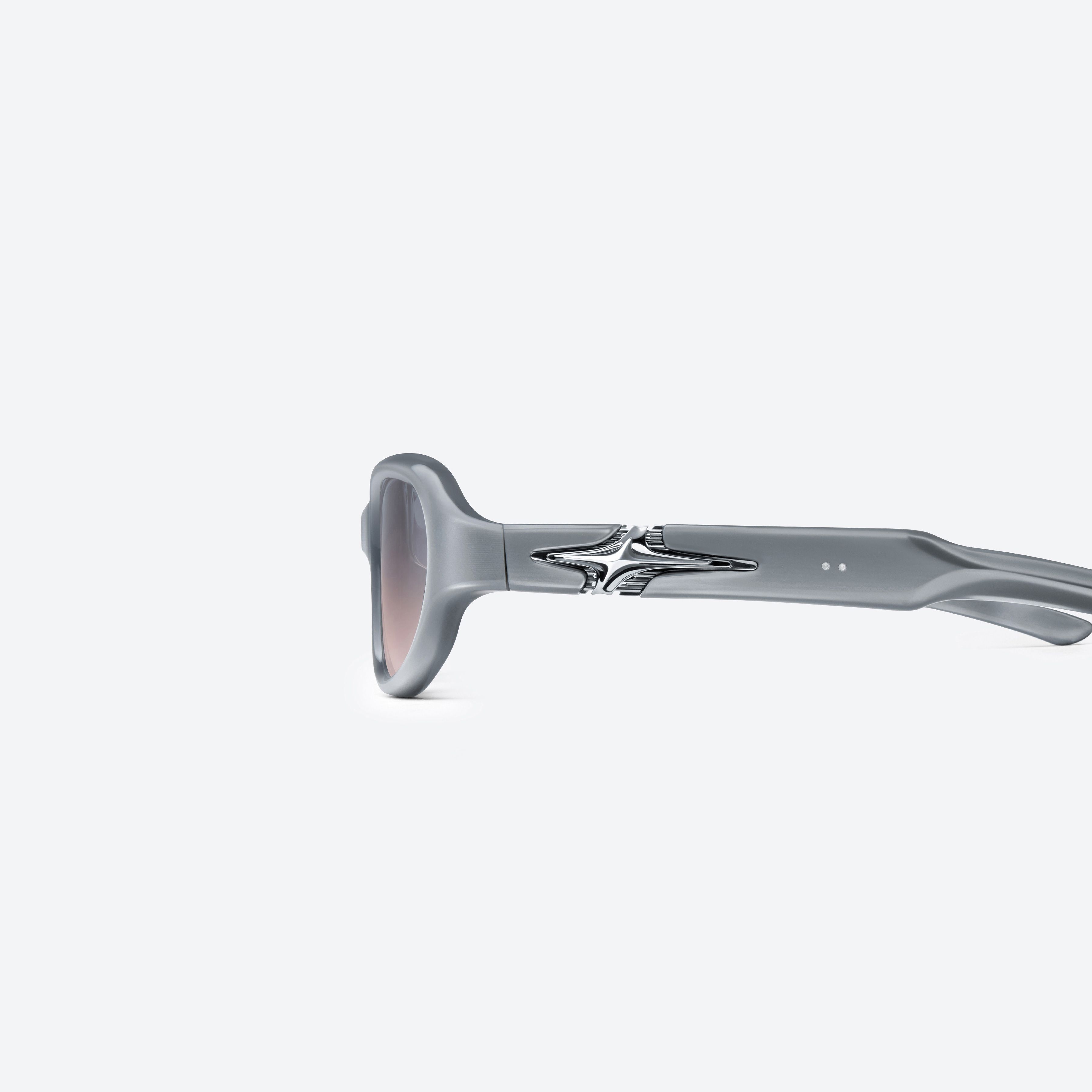 A detailed left view of Gentle Monster Soma G13 Gray Mixed framed Round glasses.