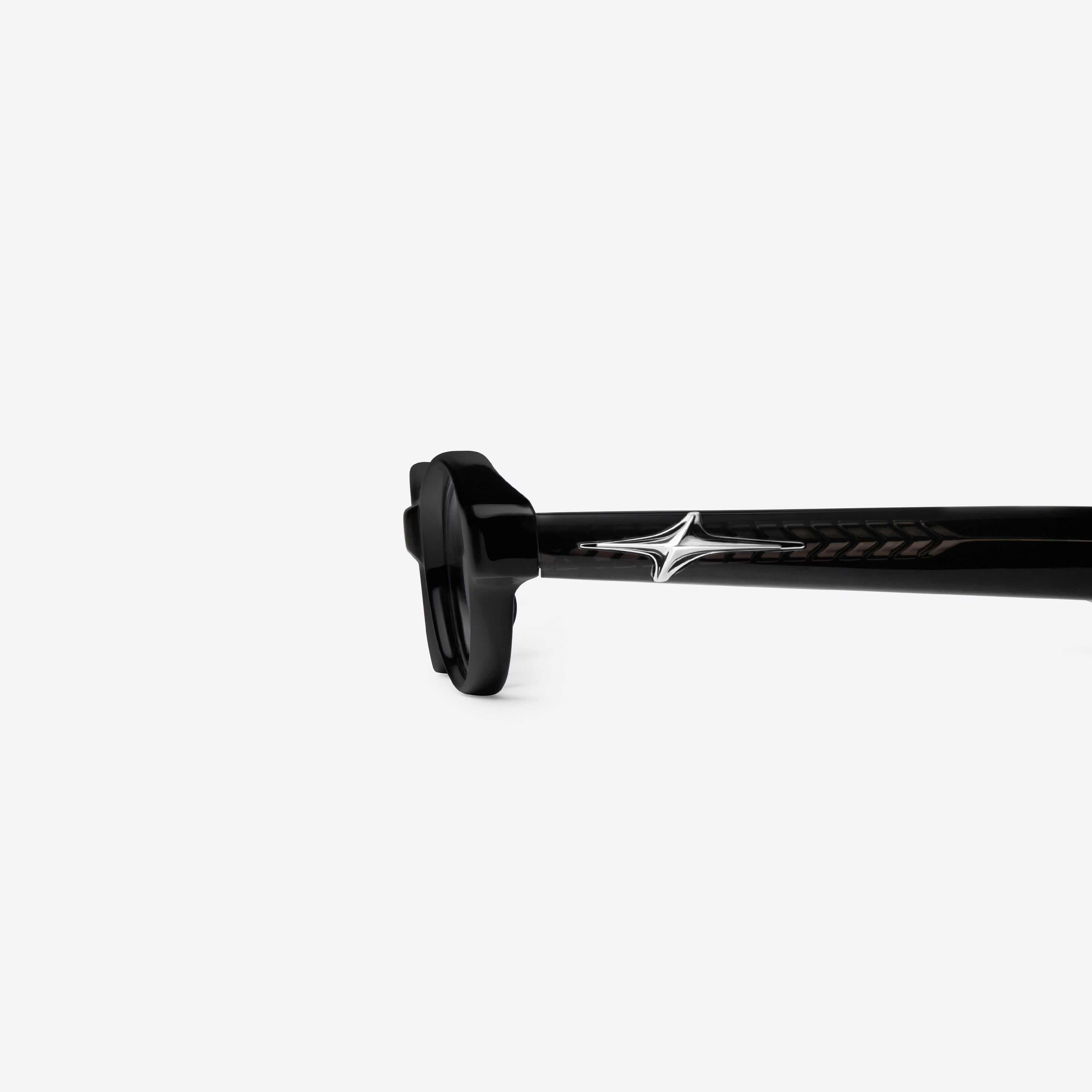 A detailed left view of Gentle Monster Odd 01 Black Acetate framed Oval glasses.