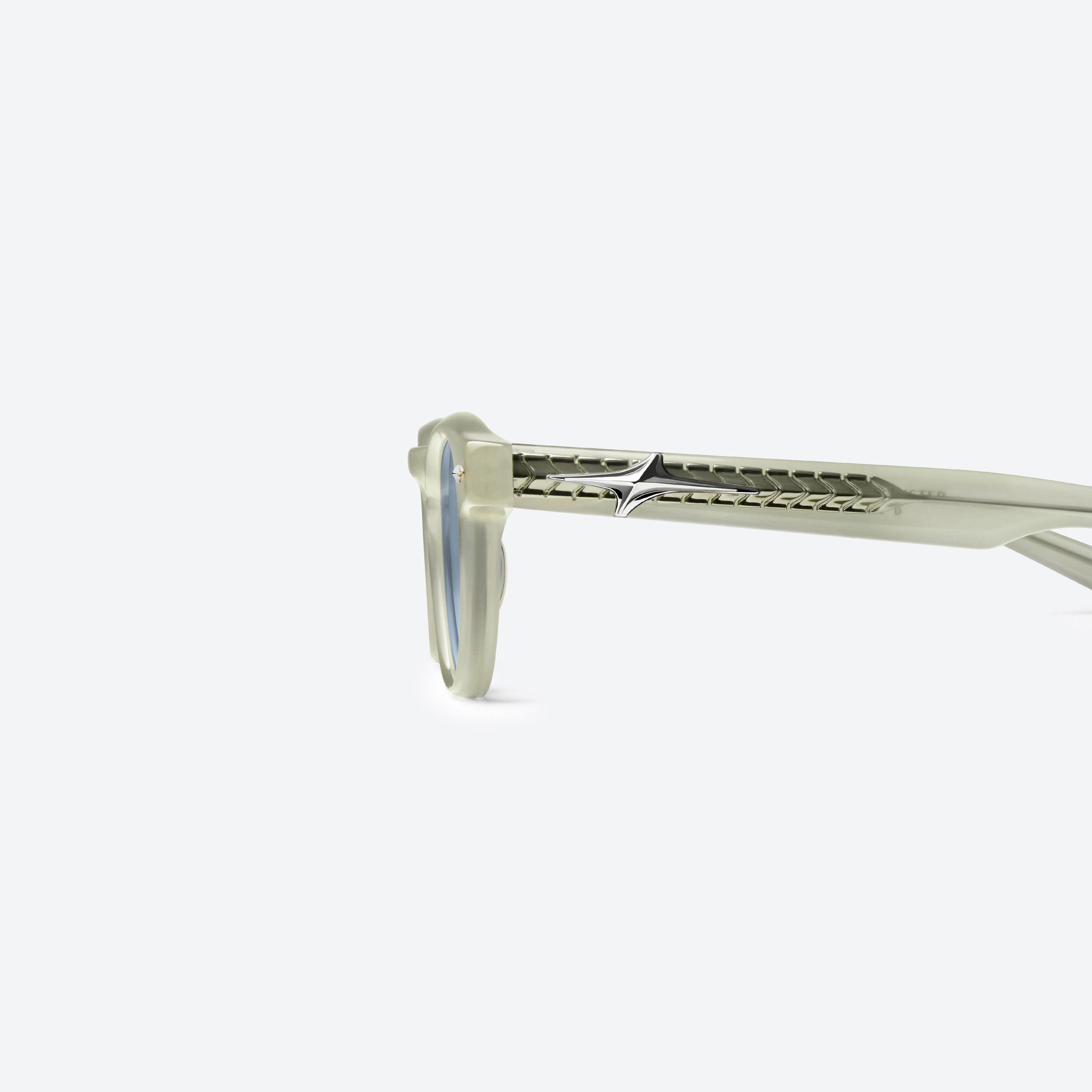 A detailed left view of Gentle Monster Von IC3 Ivory Acetate framed Round glasses.