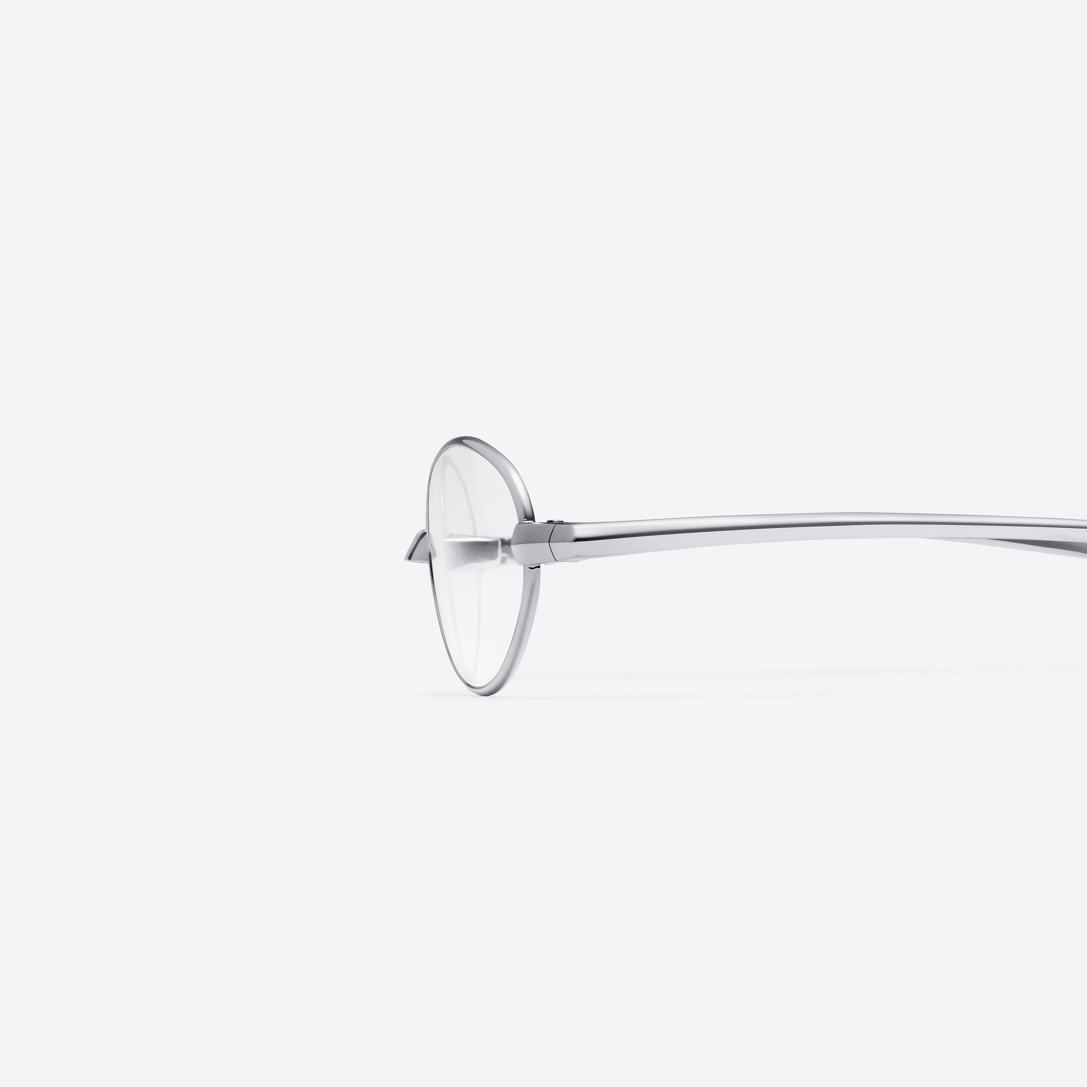 A detailed left view of Gentle Monster Faust 02 Silver Metal framed Oval glasses.