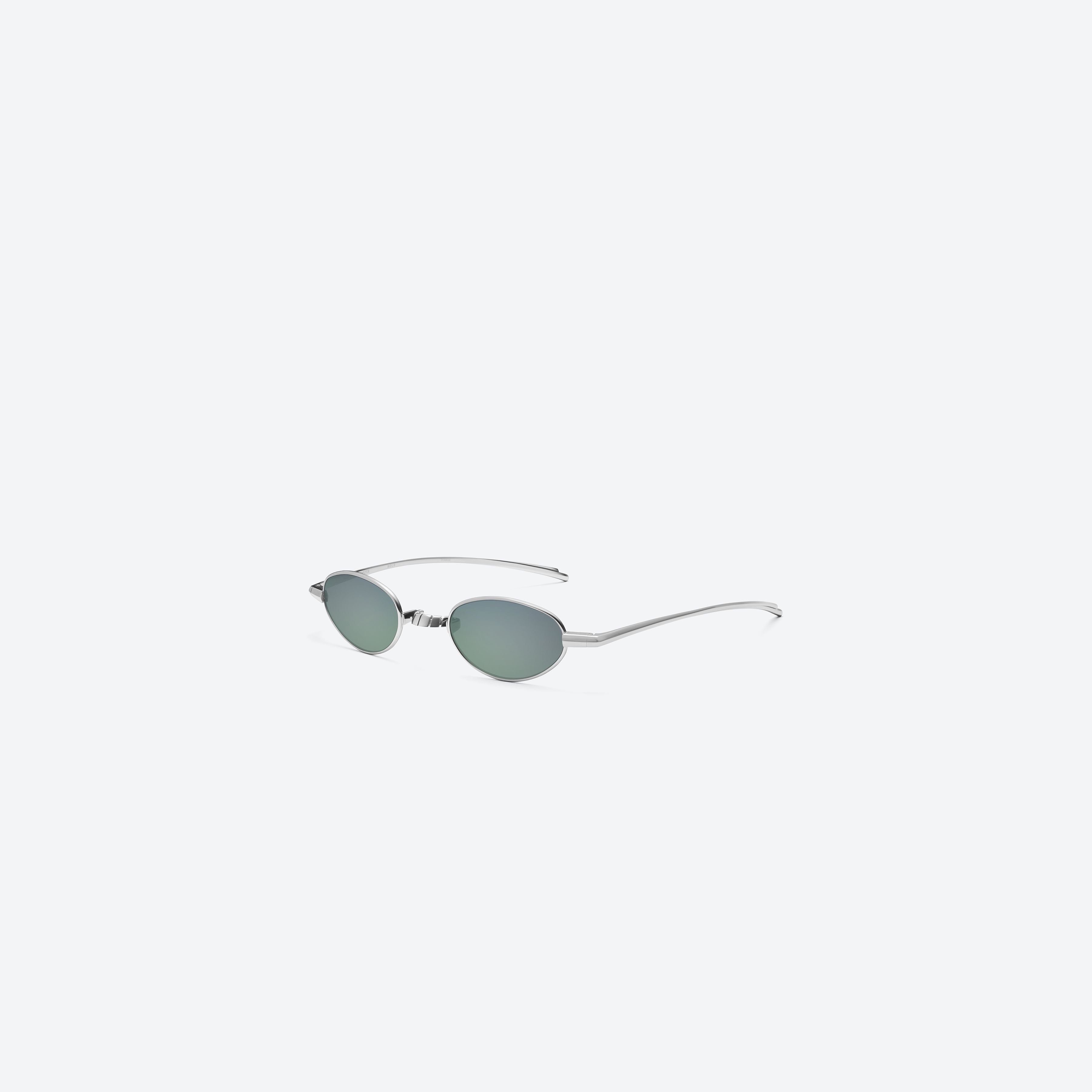 45-degree view of Gentle Monster Faust 02(MGR) Silver Metal framed Oval glasses.