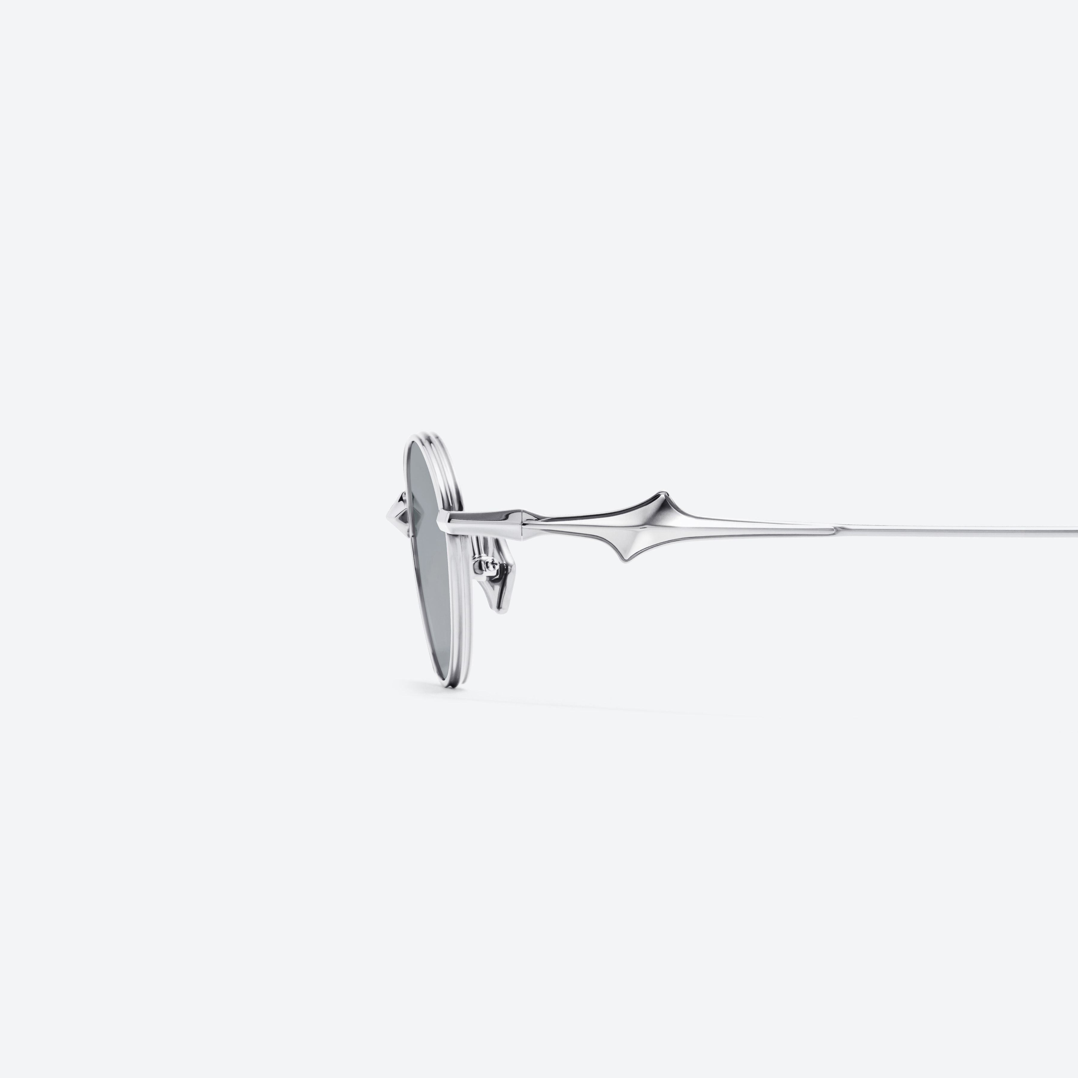 A detailed left view of Gentle Monster Eden 02(GM) Silver Metal framed Oval glasses.