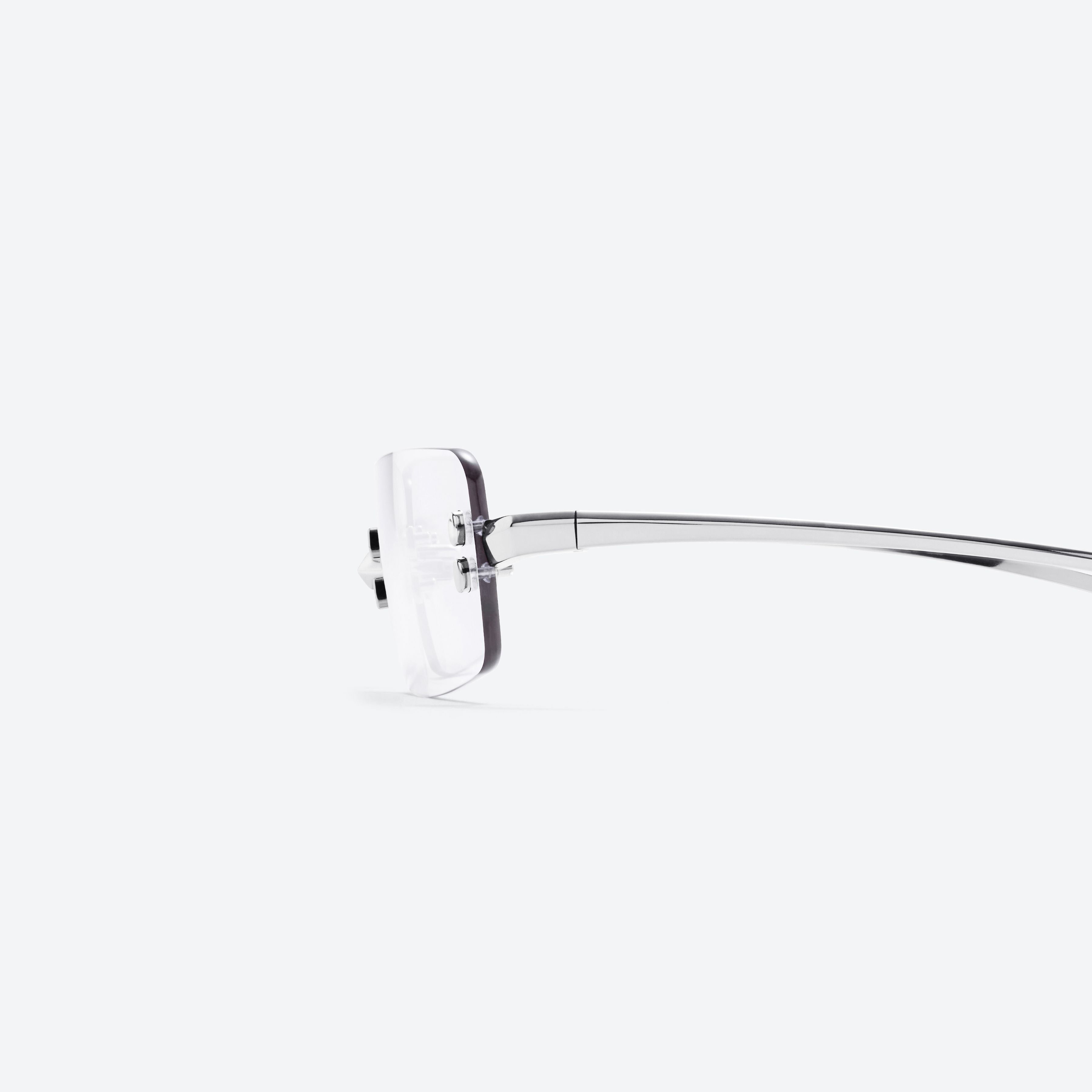 A detailed left view of Gentle Monster Paranoyd 02 Similar Silver Metal framed Square glasses.