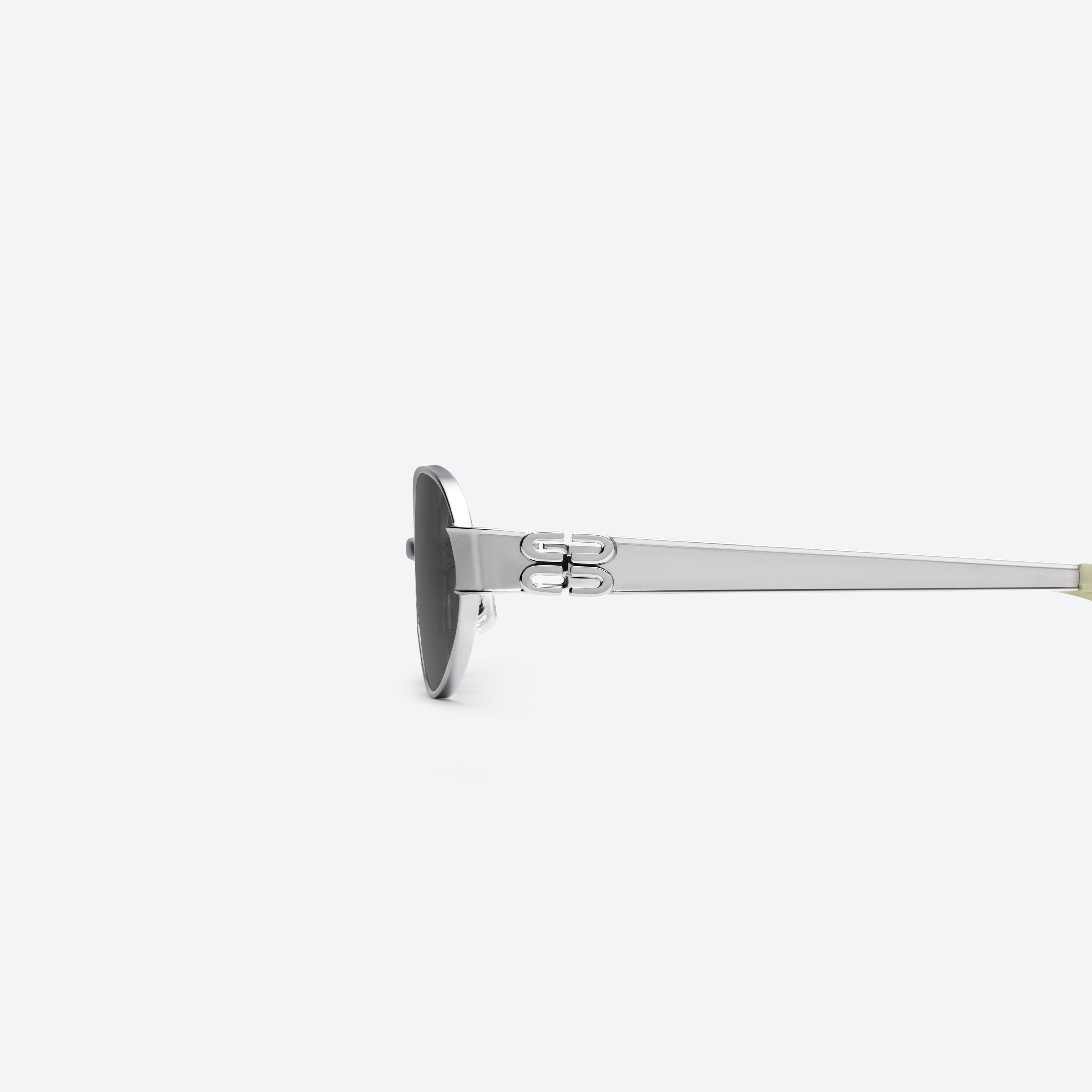A detailed left view of Gentle Monster Cali 02 Silver Metal framed Oval sunglasses.