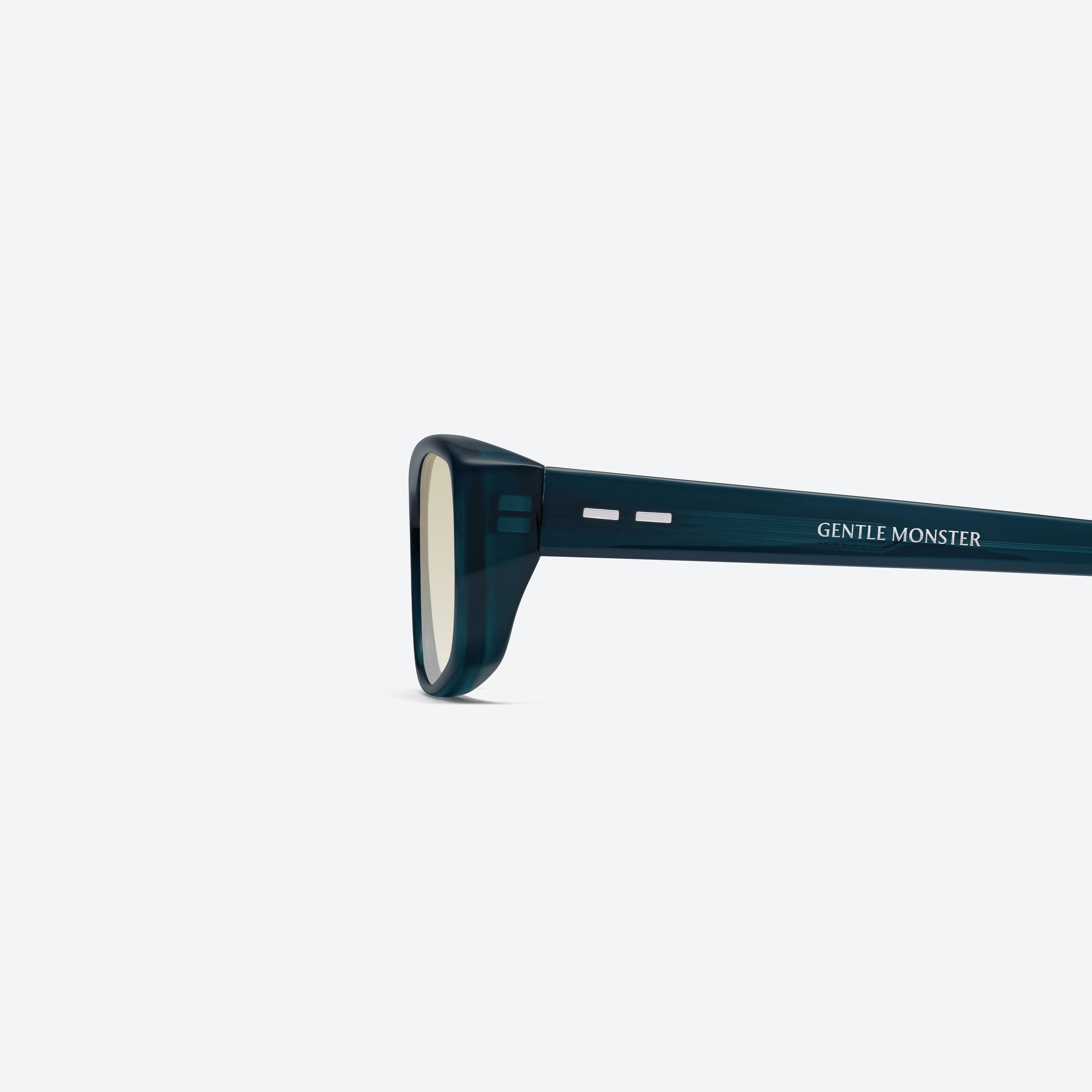 A detailed left view of Gentle Monster Noid BLC10 Blue Acetate framed Square sunglasses.