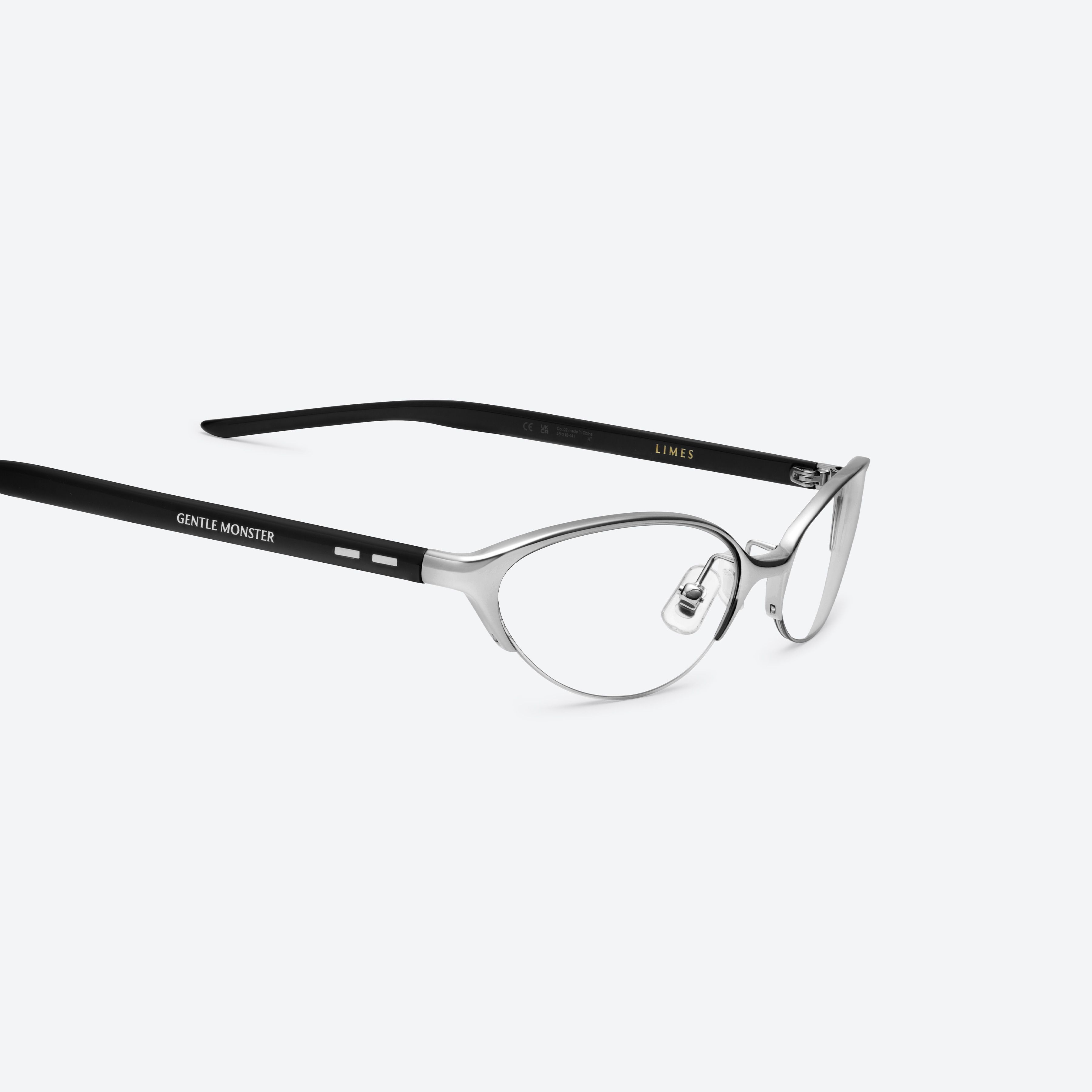 45-degree detailed view of Gentle Monster Limes 02 Silver Mixed framed Cat-eye glasses.