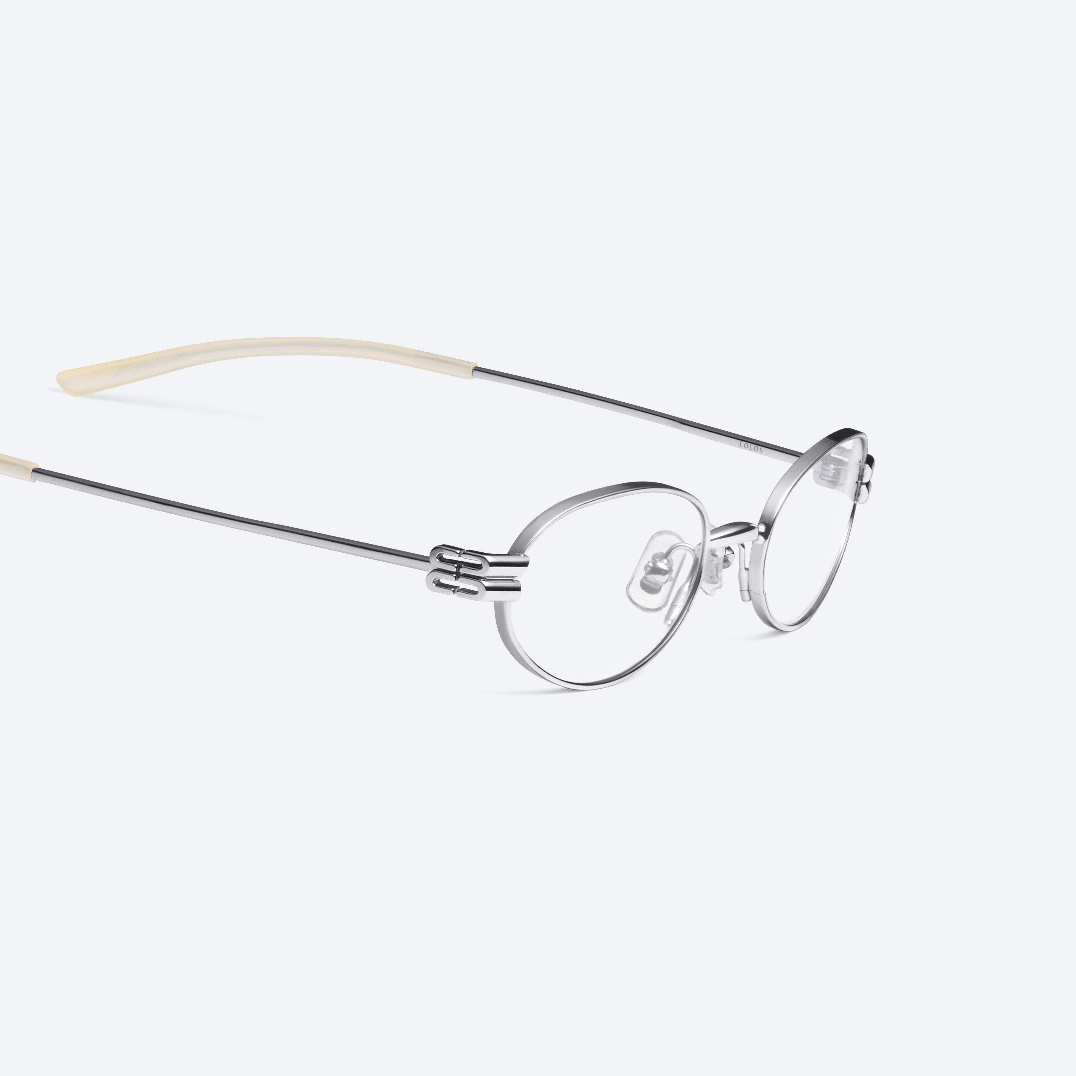 45-degree detailed view of Gentle Monster Lolos 02 Silver Metal framed Oval glasses.