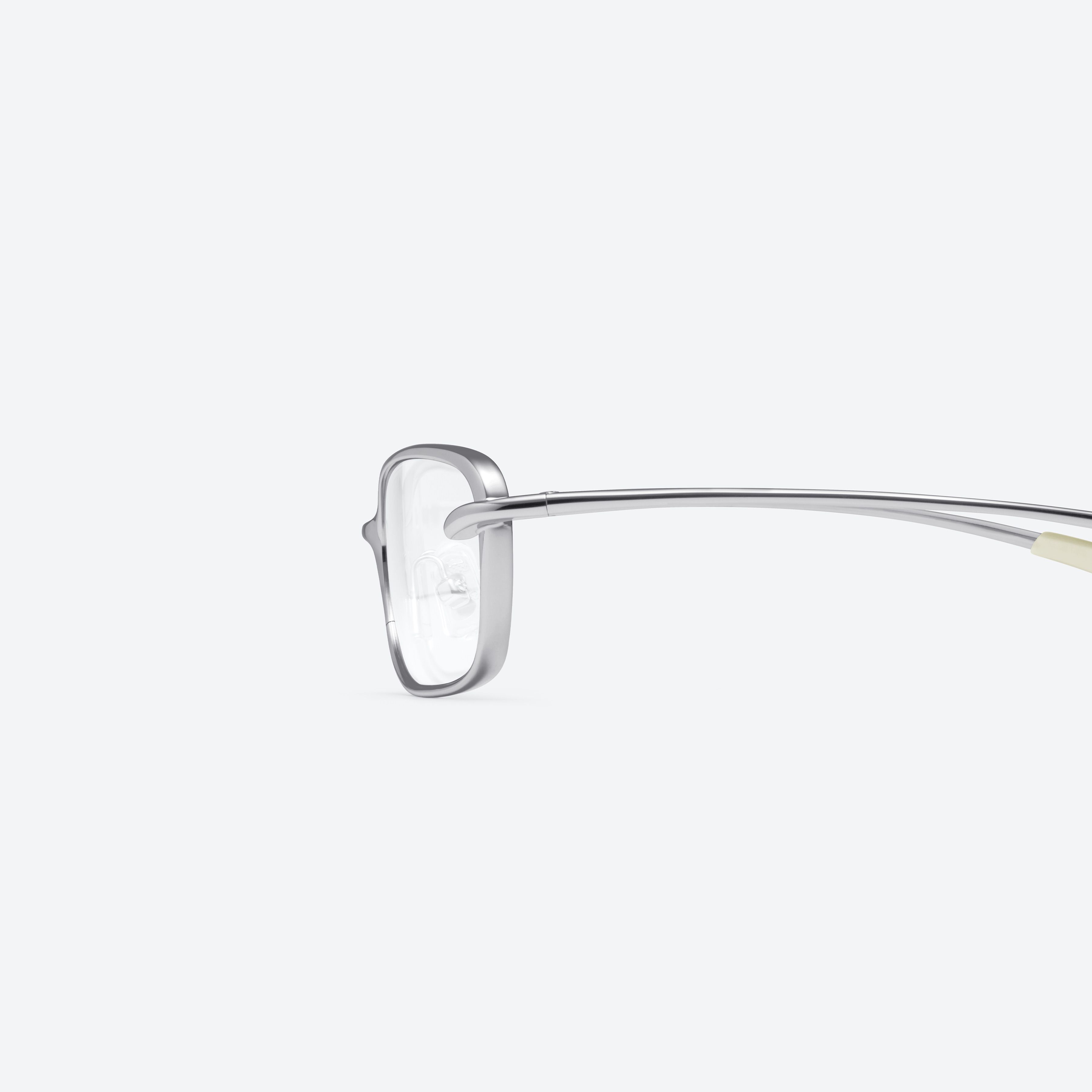 A detailed left view of Gentle Monster Rollie 02 Silver Metal framed Square glasses.