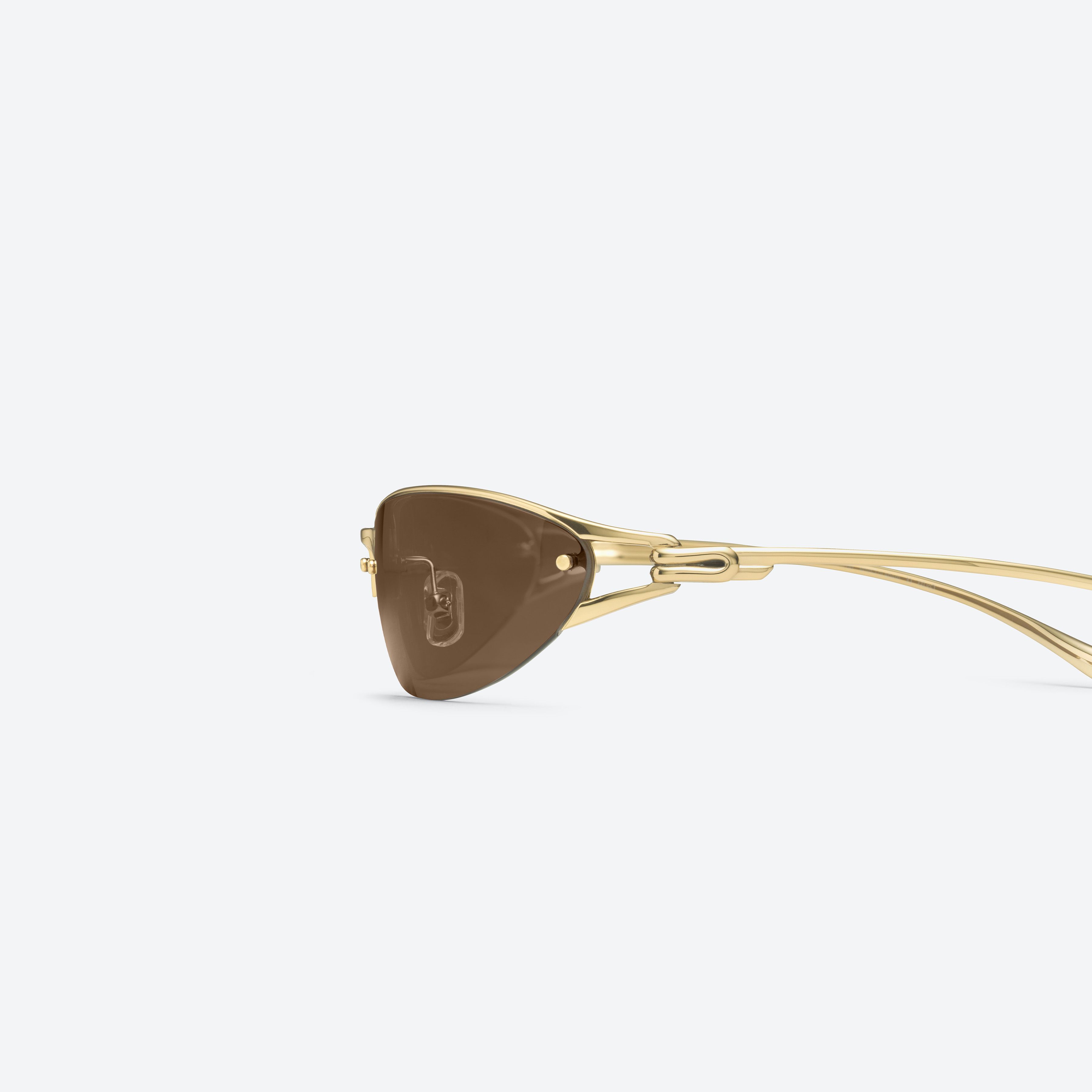 A detailed left view of Gentle Monster Futura 03 Gold Metal framed Wraparound sunglasses.