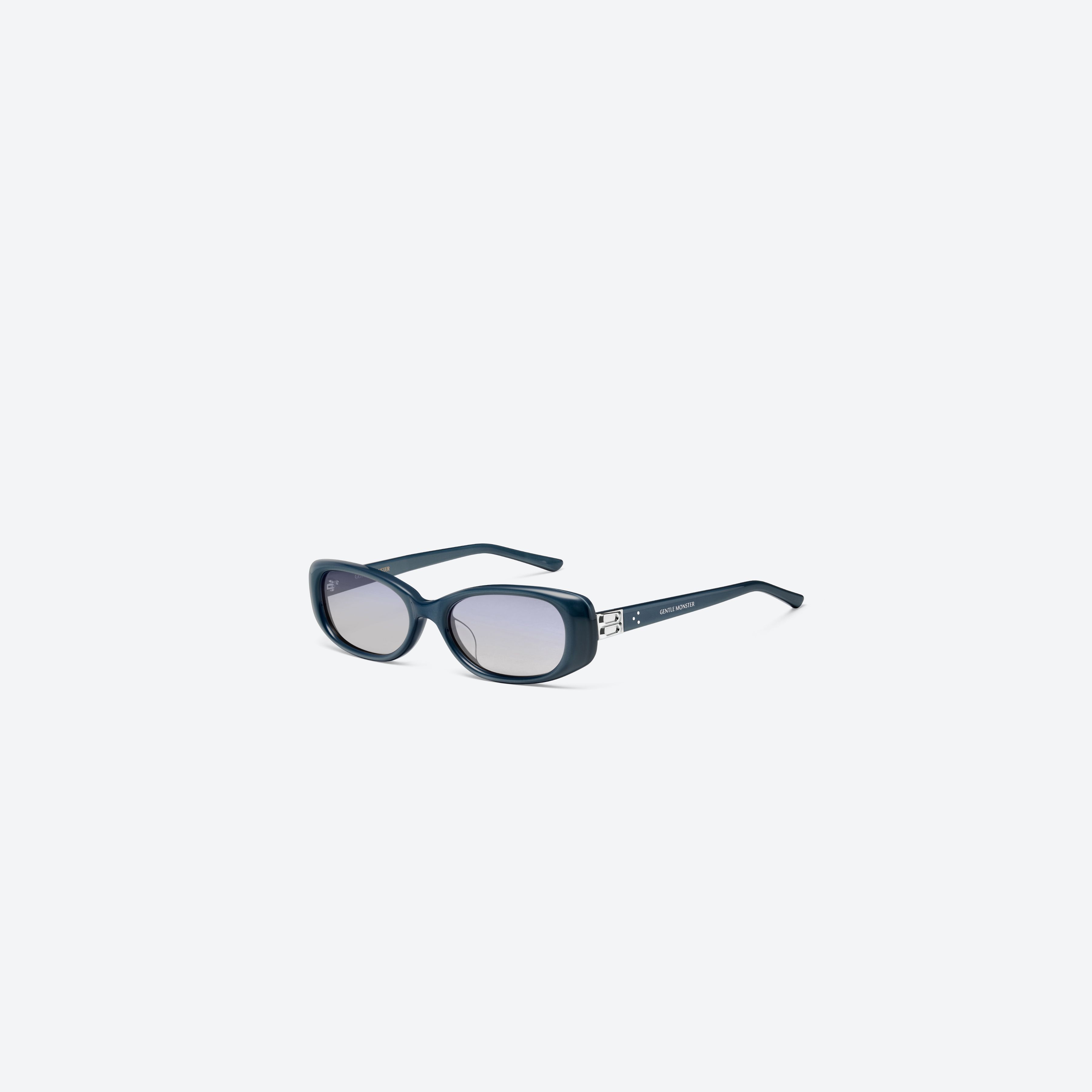 45-degree view of Gentle Monster Dust Musk BL9 Blue Acetate framed Square sunglasses.