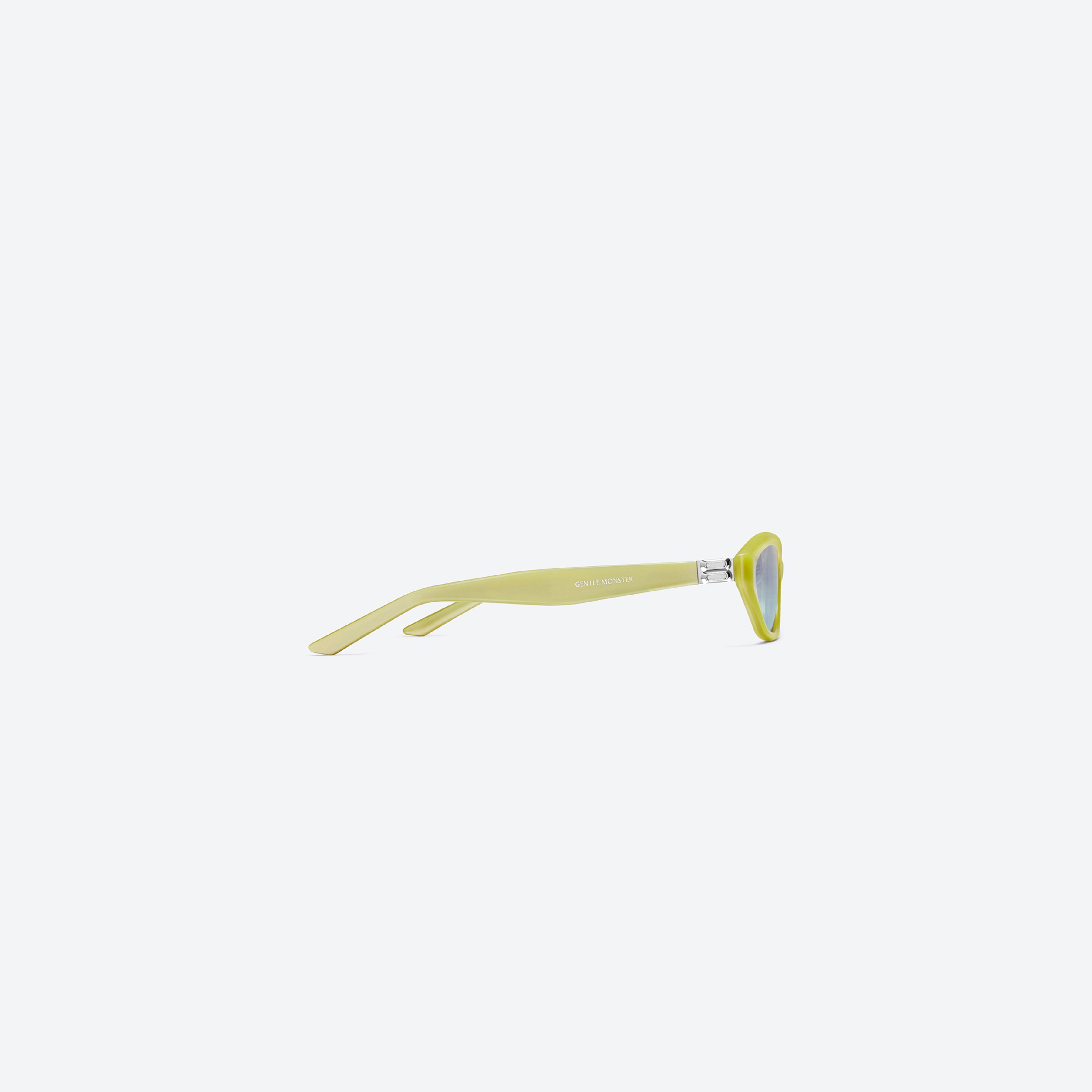 A detailed right view of Gentle Monster LAMDA Y9 Yellow Acetate framed Cat-eye sunglasses.