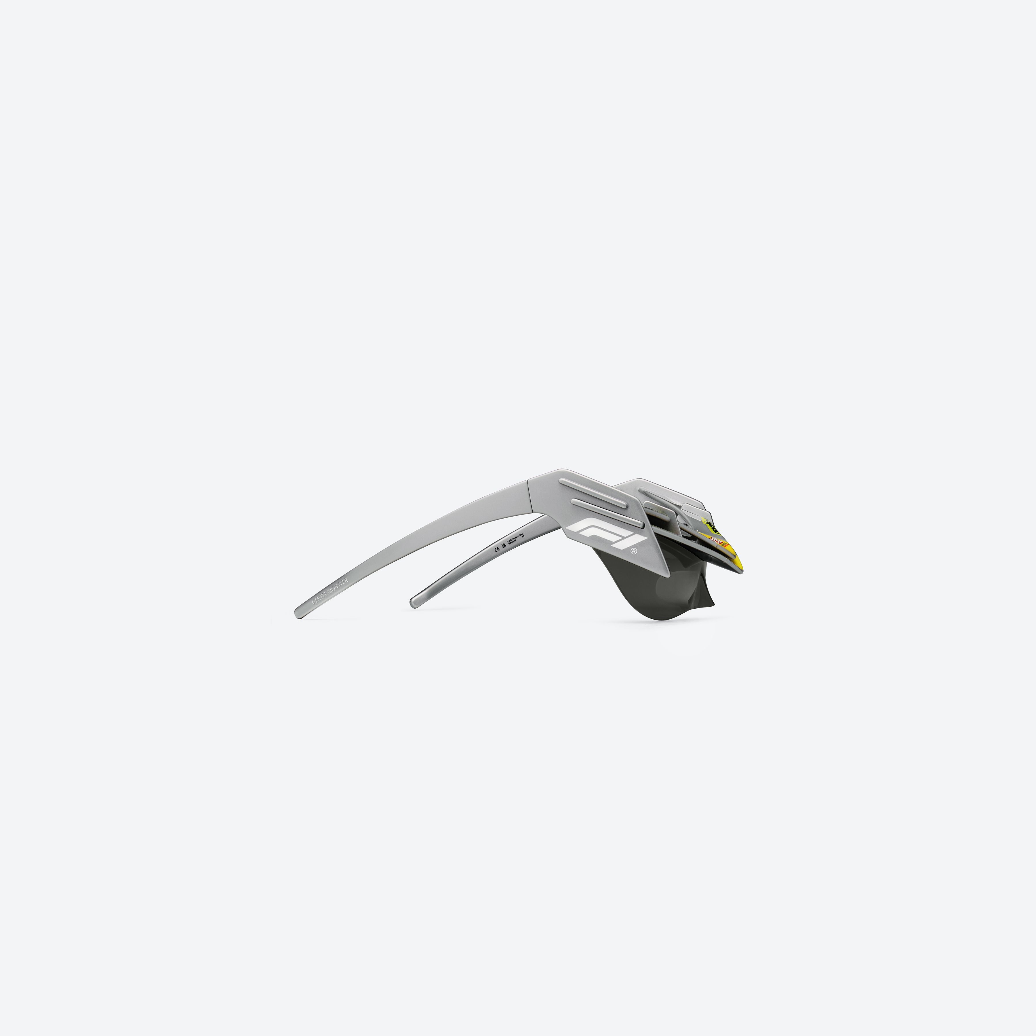 A detailed right view of Gentle Monster Disney F1 - Wing 4 G21 Gray Nylon framed Wraparound sunglasses.