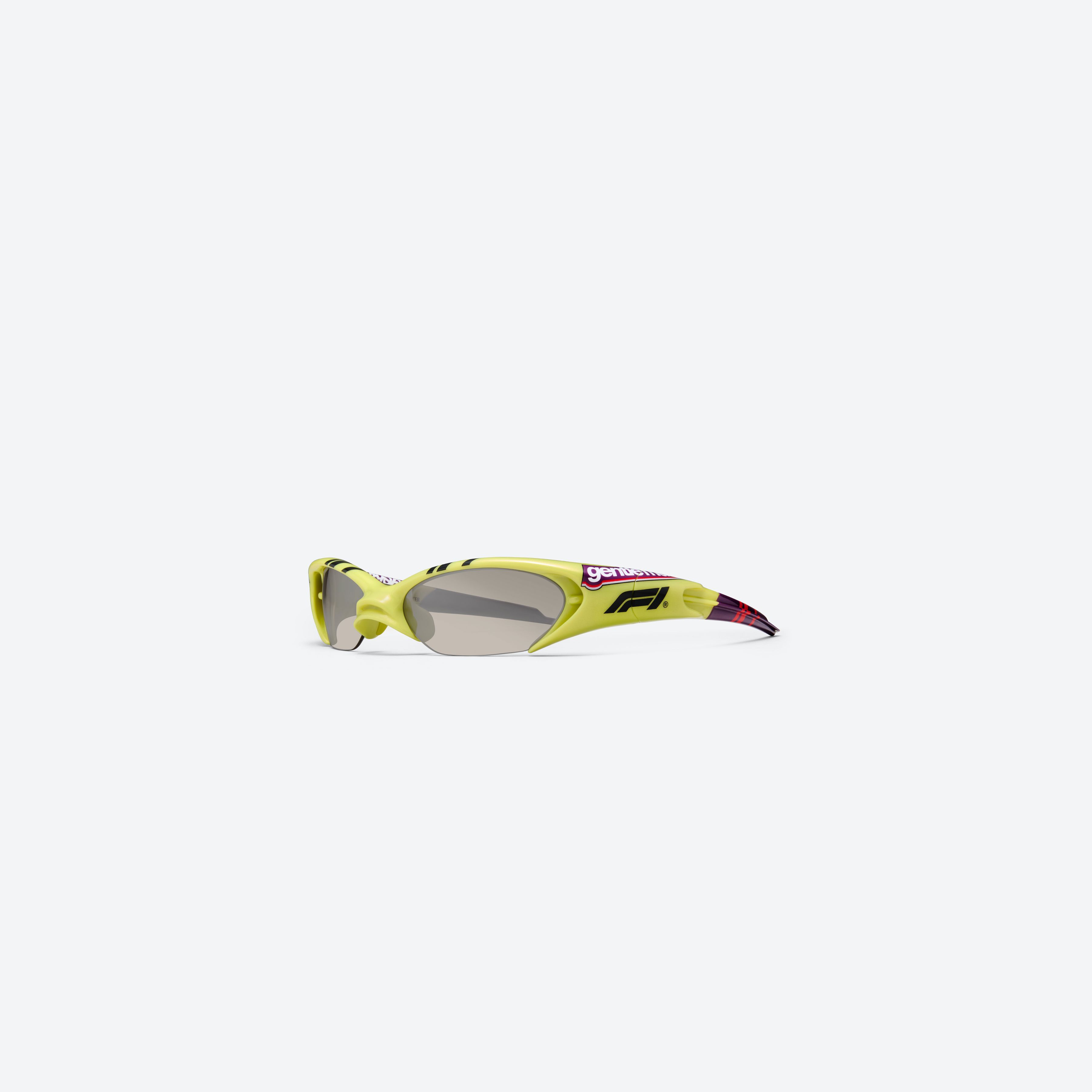 45-degree view of Gentle Monster SLIPSTREAM GR13 Green Nylon framed Wraparound sunglasses.
