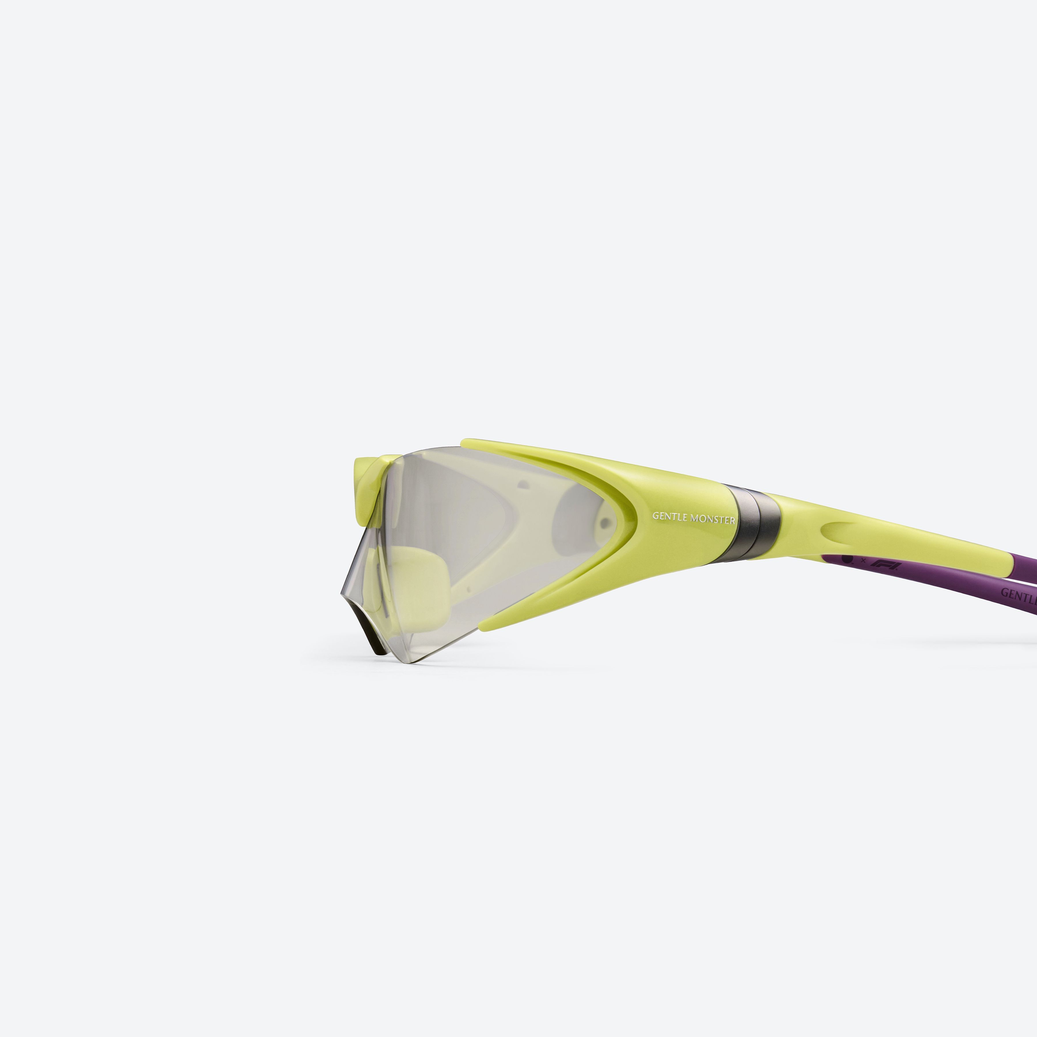 A detailed left view of Gentle Monster Disney F1 - Aero GR13 Green Nylon framed Wraparound sunglasses.