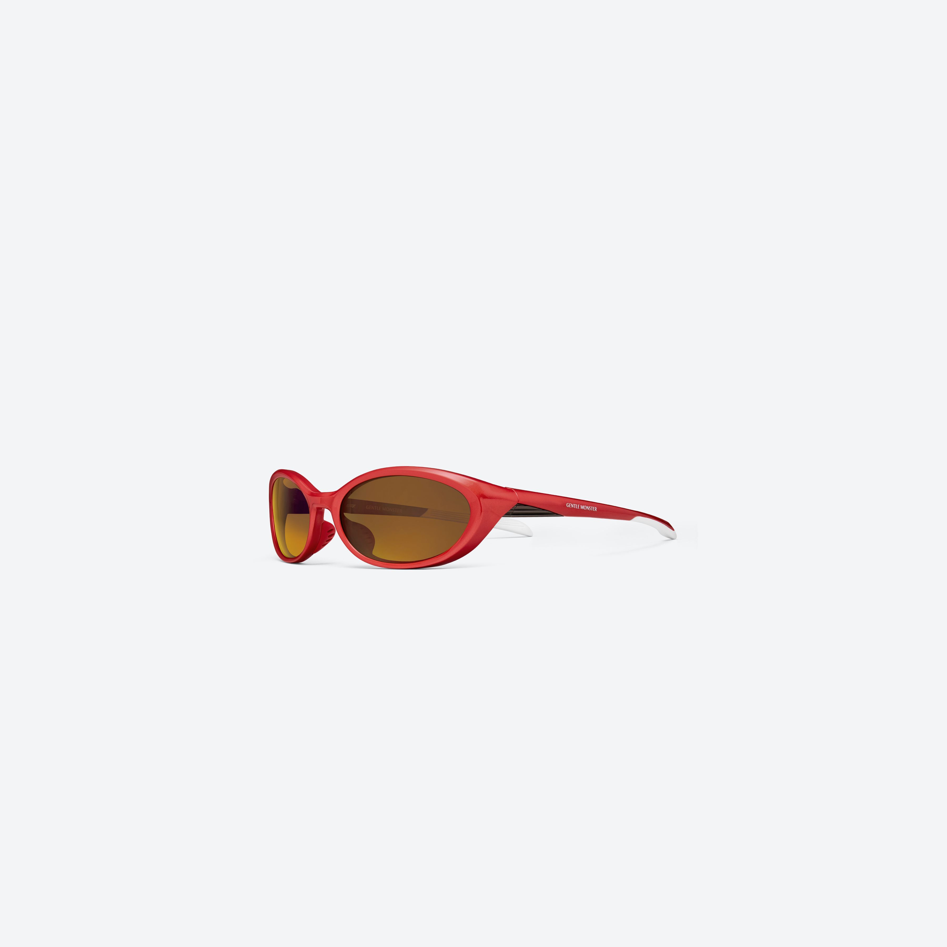 45-degree view of Gentle Monster RIM R13 Red Nylon framed Wraparound sunglasses.
