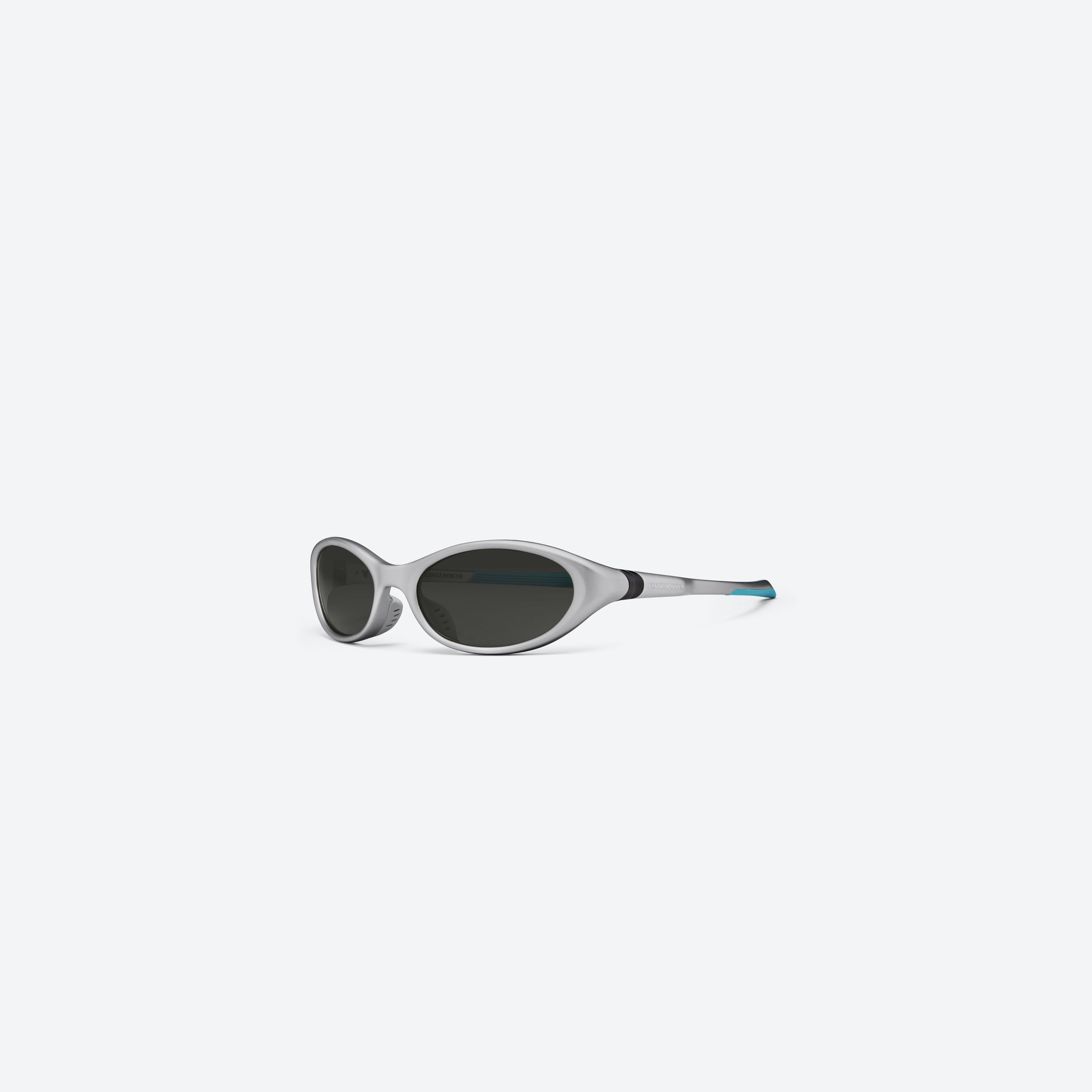 45-degree view of Gentle Monster VELO MG21 Gray Nylon framed Wraparound sunglasses.