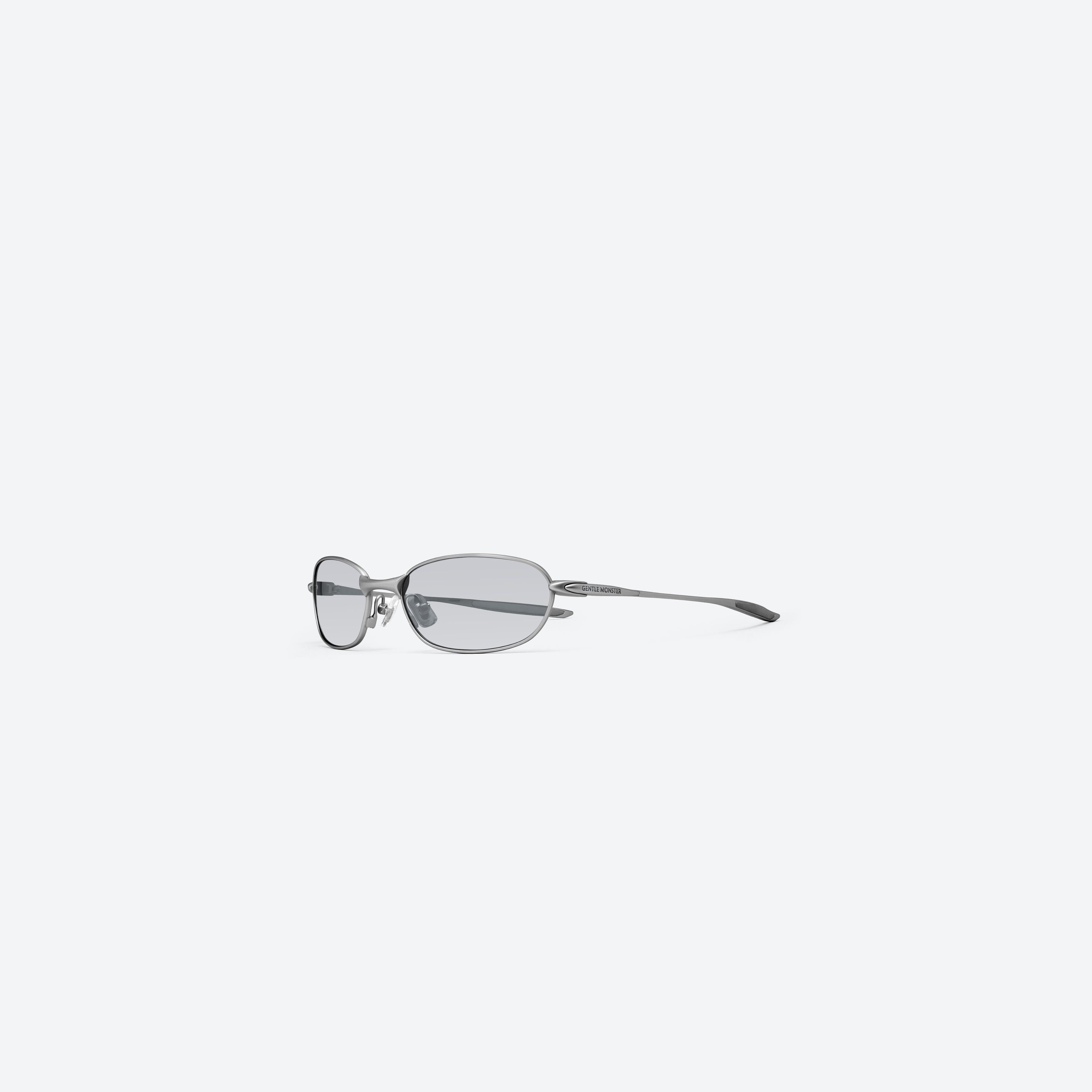 45-degree view of Gentle Monster Pitot M021 Gray Metal framed Wraparound sunglasses.
