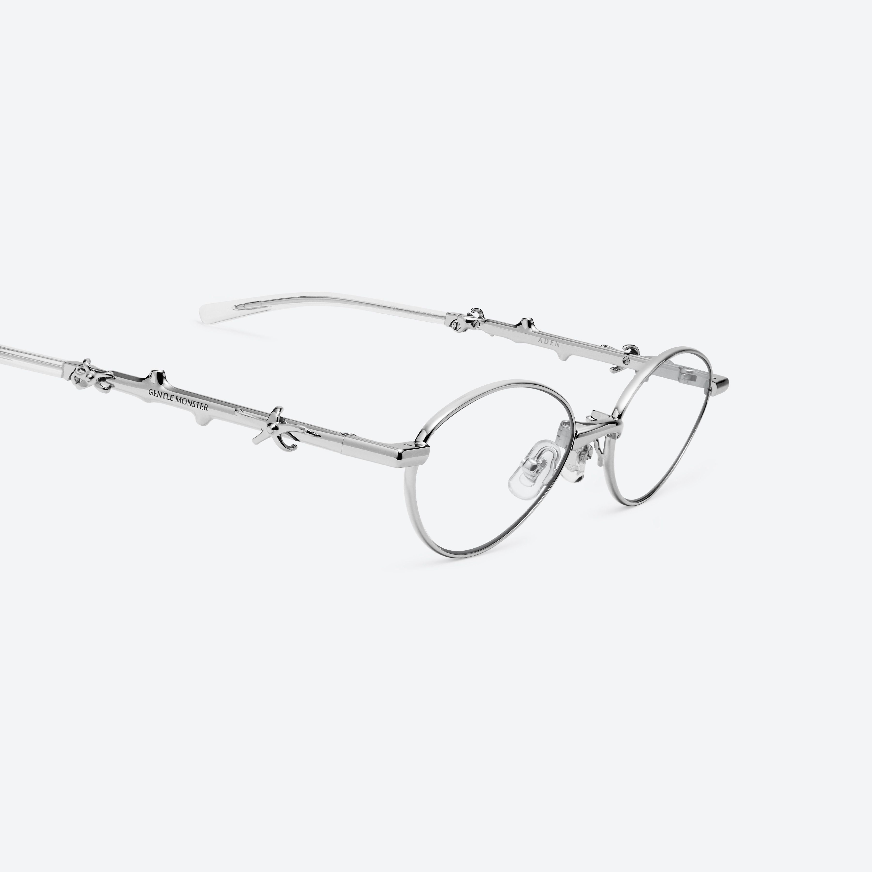 45-degree detailed view of Gentle Monster Aden 02 Silver Metal framed Oval glasses.