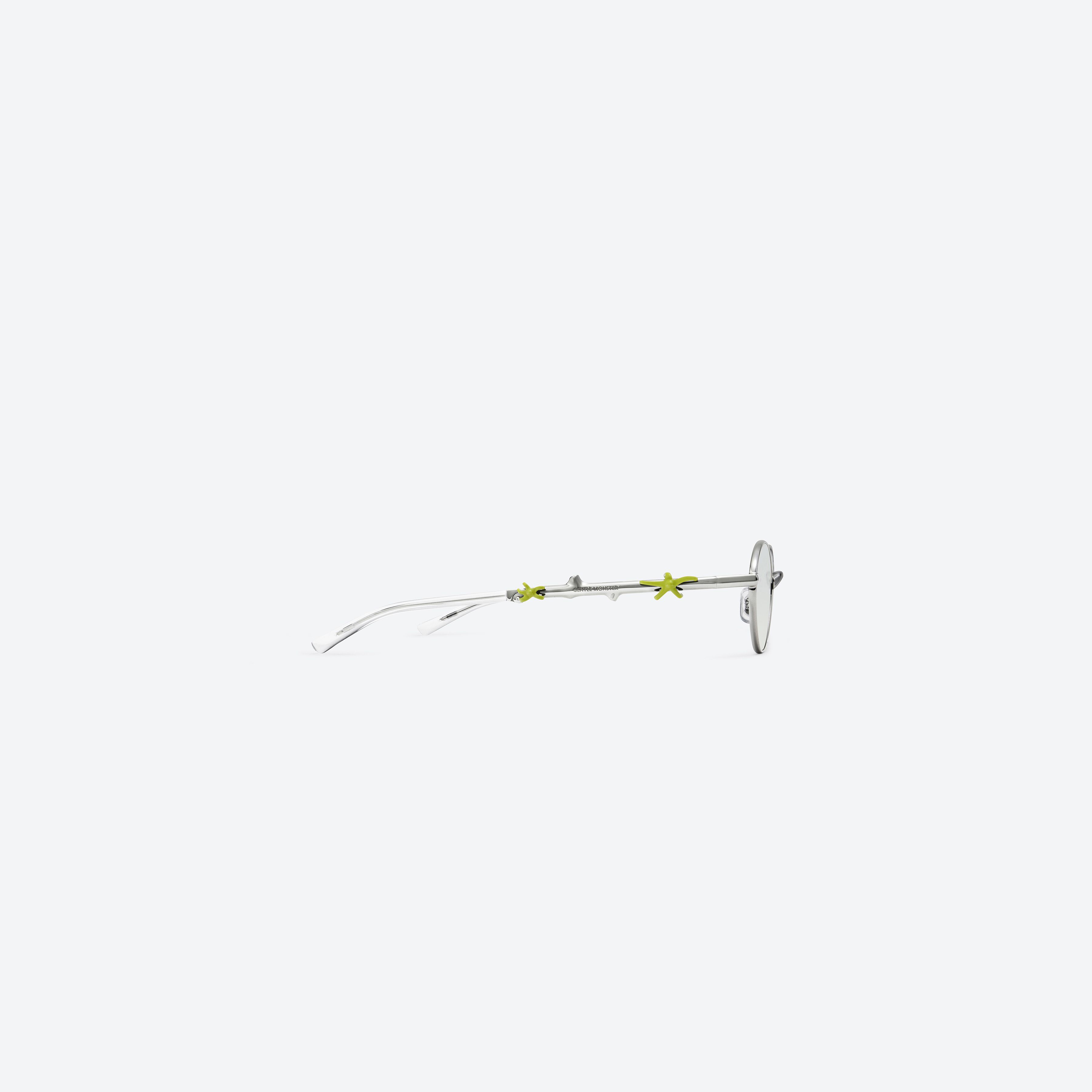 A detailed right view of Gentle Monster Aden 02(GRM) Silver Metal framed Oval sunglasses.