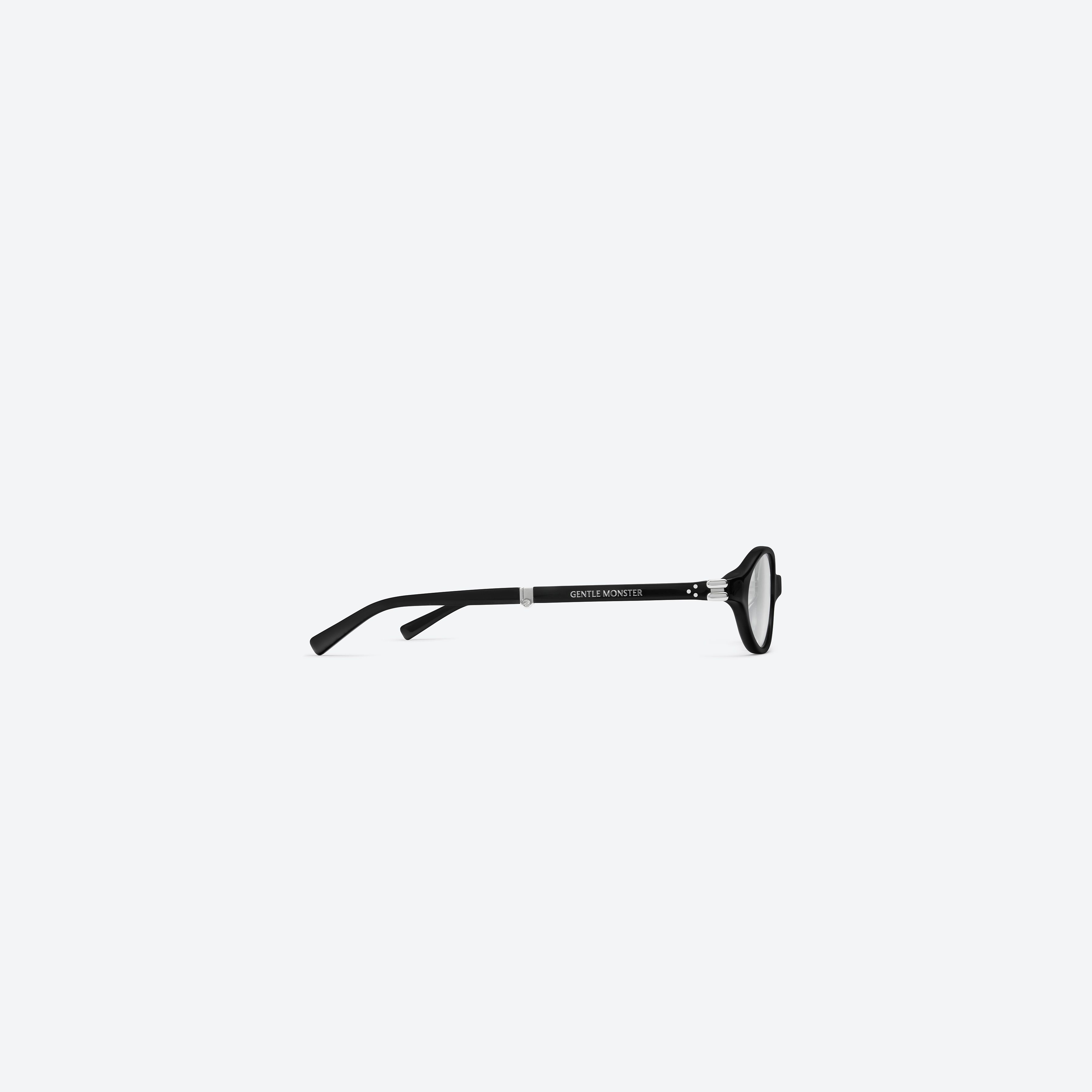 A detailed right view of Gentle Monster Ivy 01(C) Black Acetate framed Oval glasses.