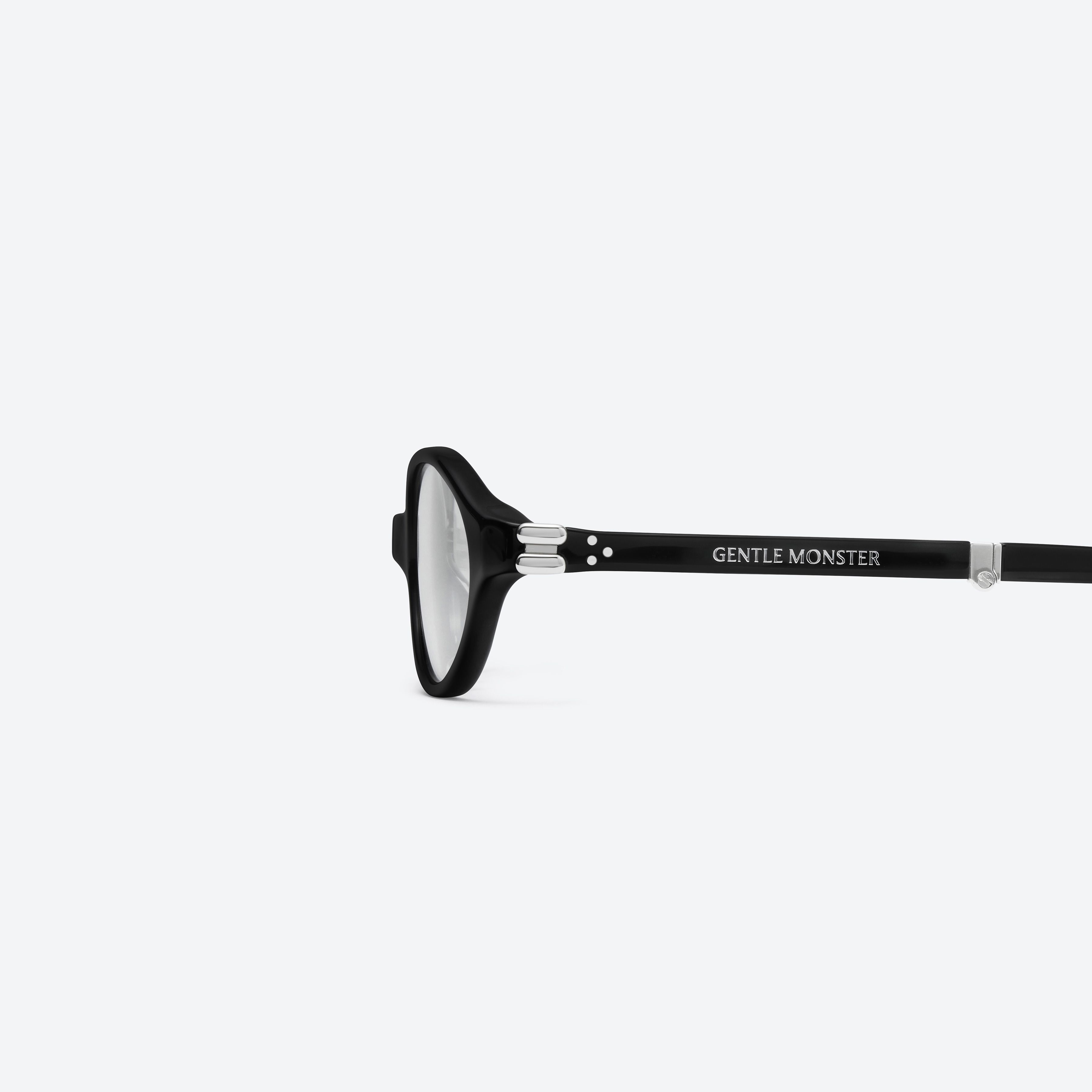 A detailed left view of Gentle Monster Ivy 01(C) Black Acetate framed Oval glasses.