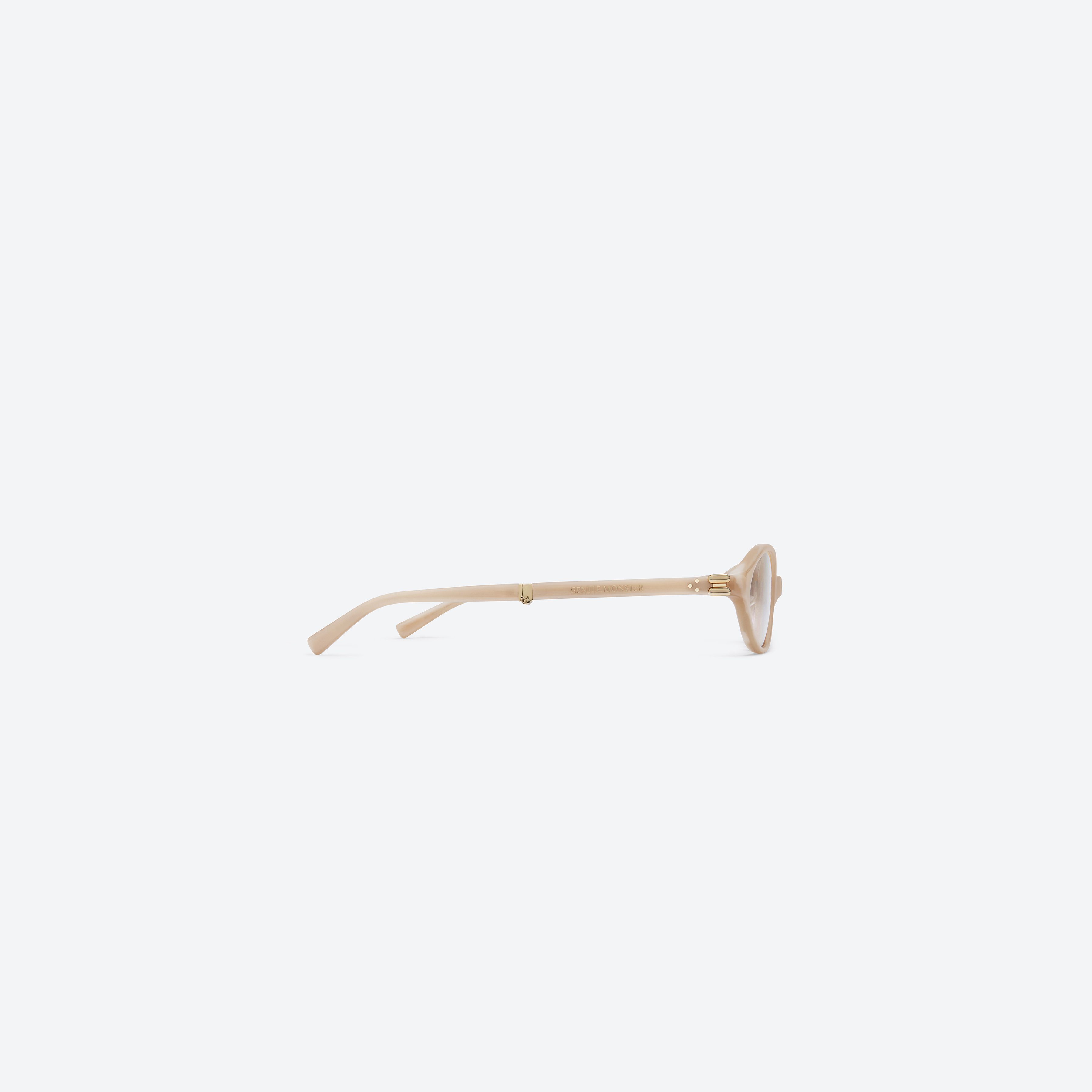 A detailed right view of Gentle Monster Ivy IVD1 Ivory Acetate framed Oval sunglasses.