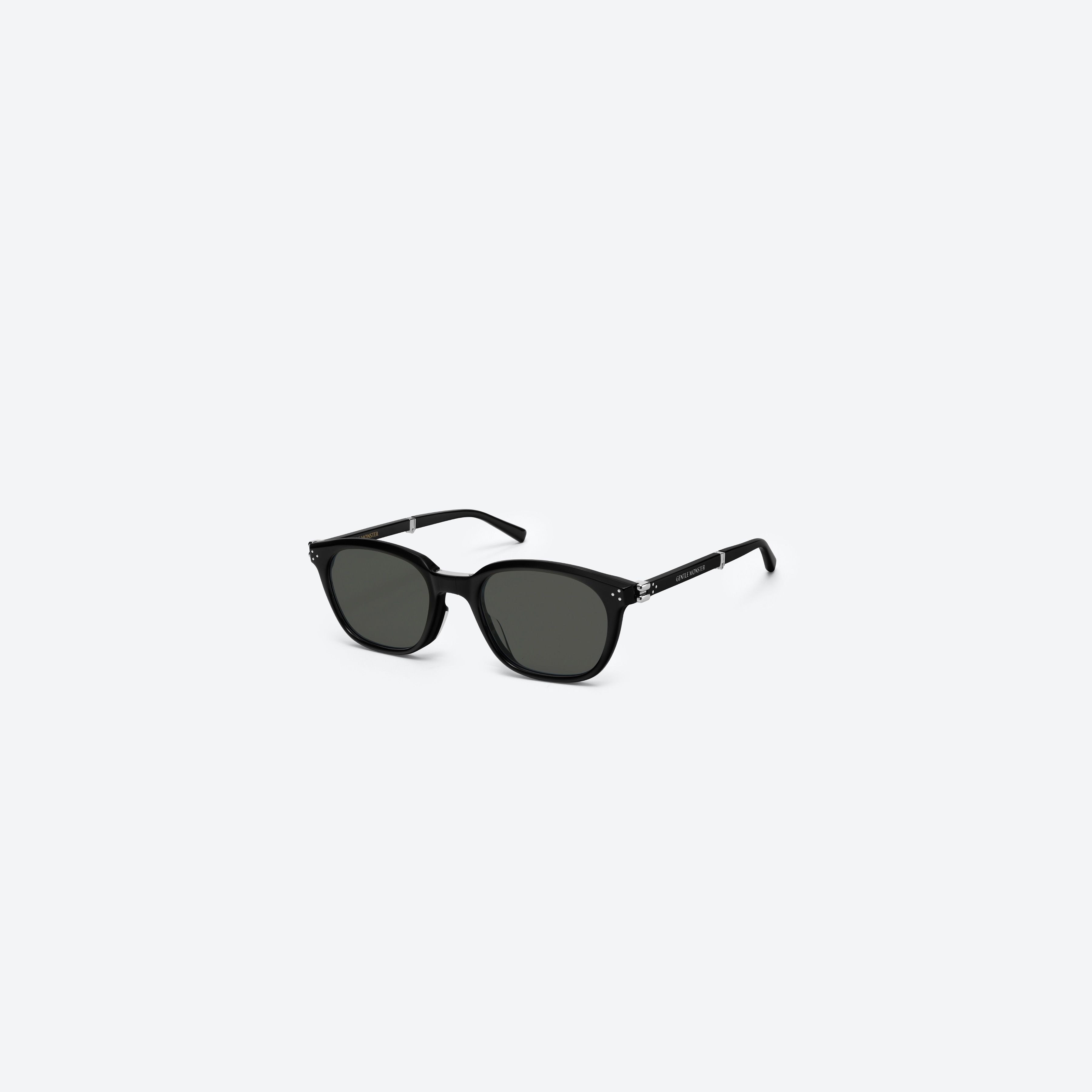 45-degree view of Gentle Monster Jasmin 01 Black Acetate framed Square sunglasses.