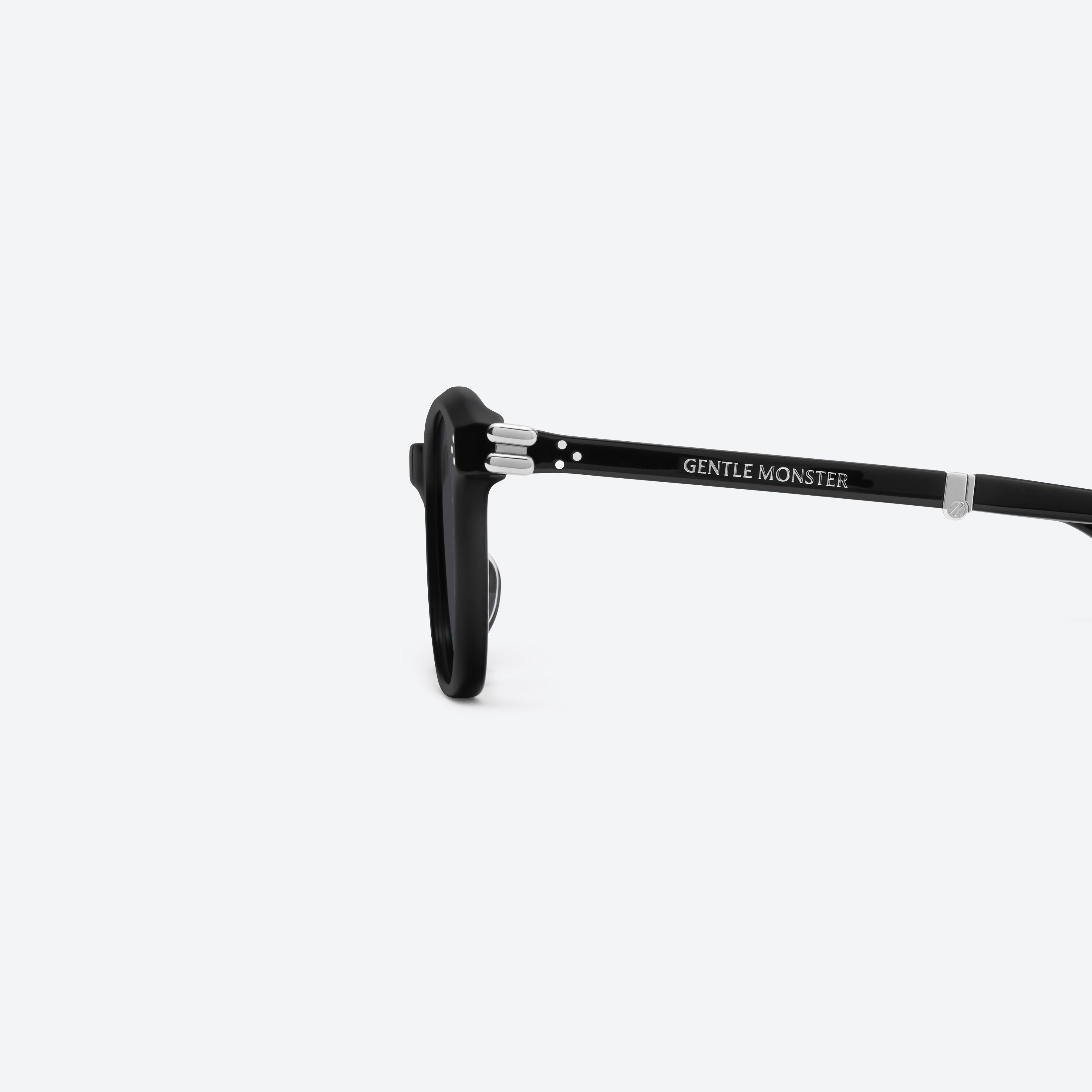A detailed left view of Gentle Monster Jasmin 01 Black Acetate framed Square sunglasses.