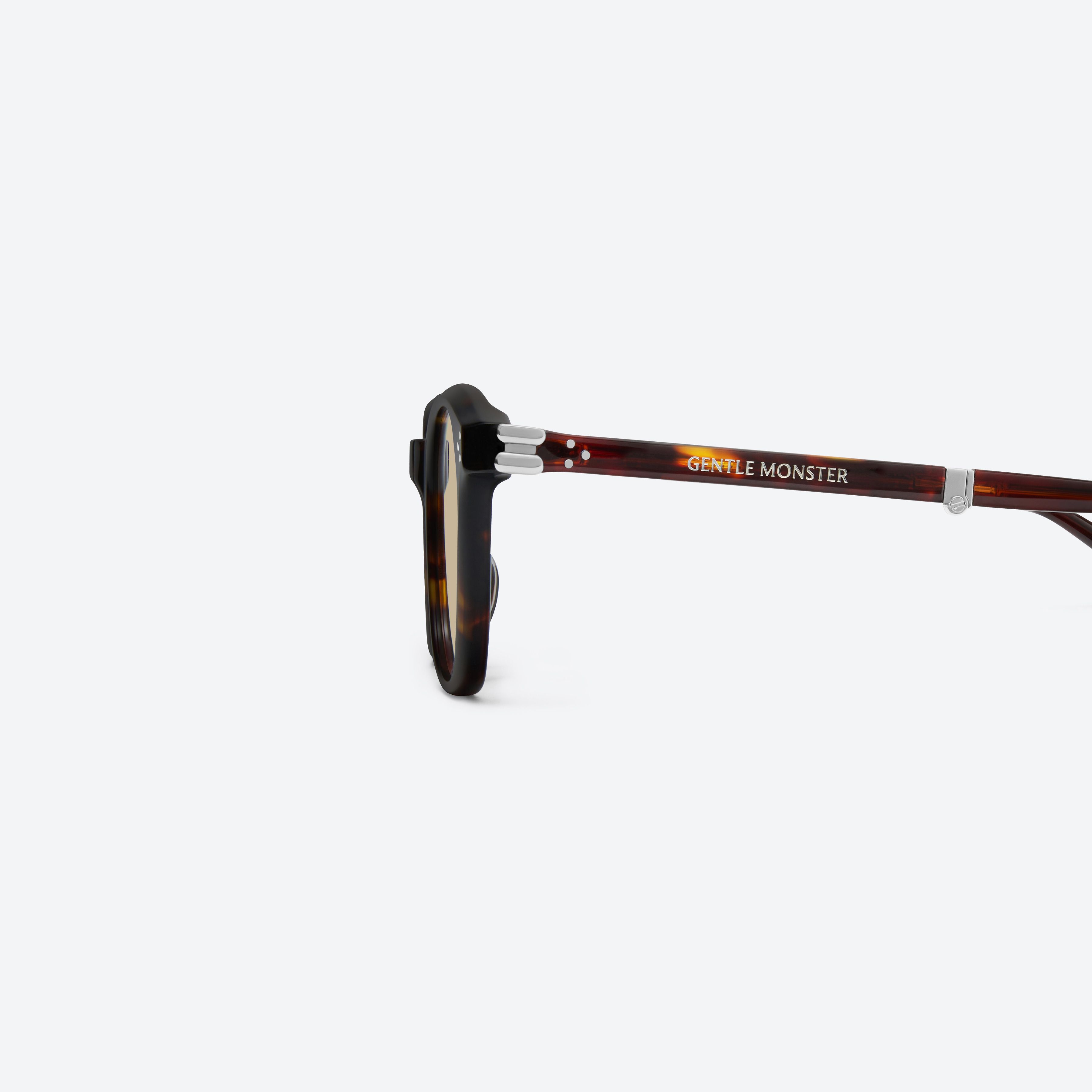 A detailed left view of Gentle Monster Jasmin T1 Tortoise Acetate framed Square sunglasses.
