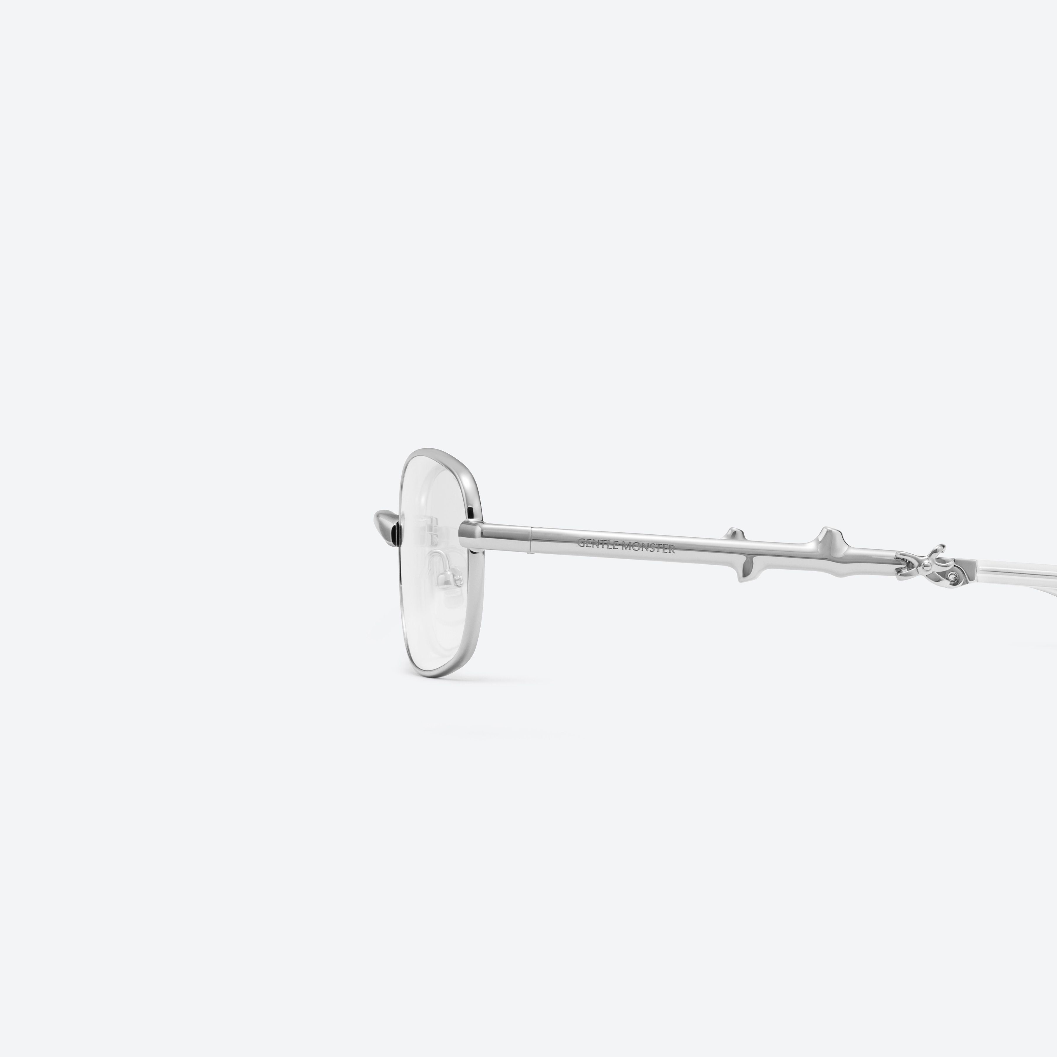 A detailed left view of Gentle Monster Mori 02 Silver Metal framed Square glasses.