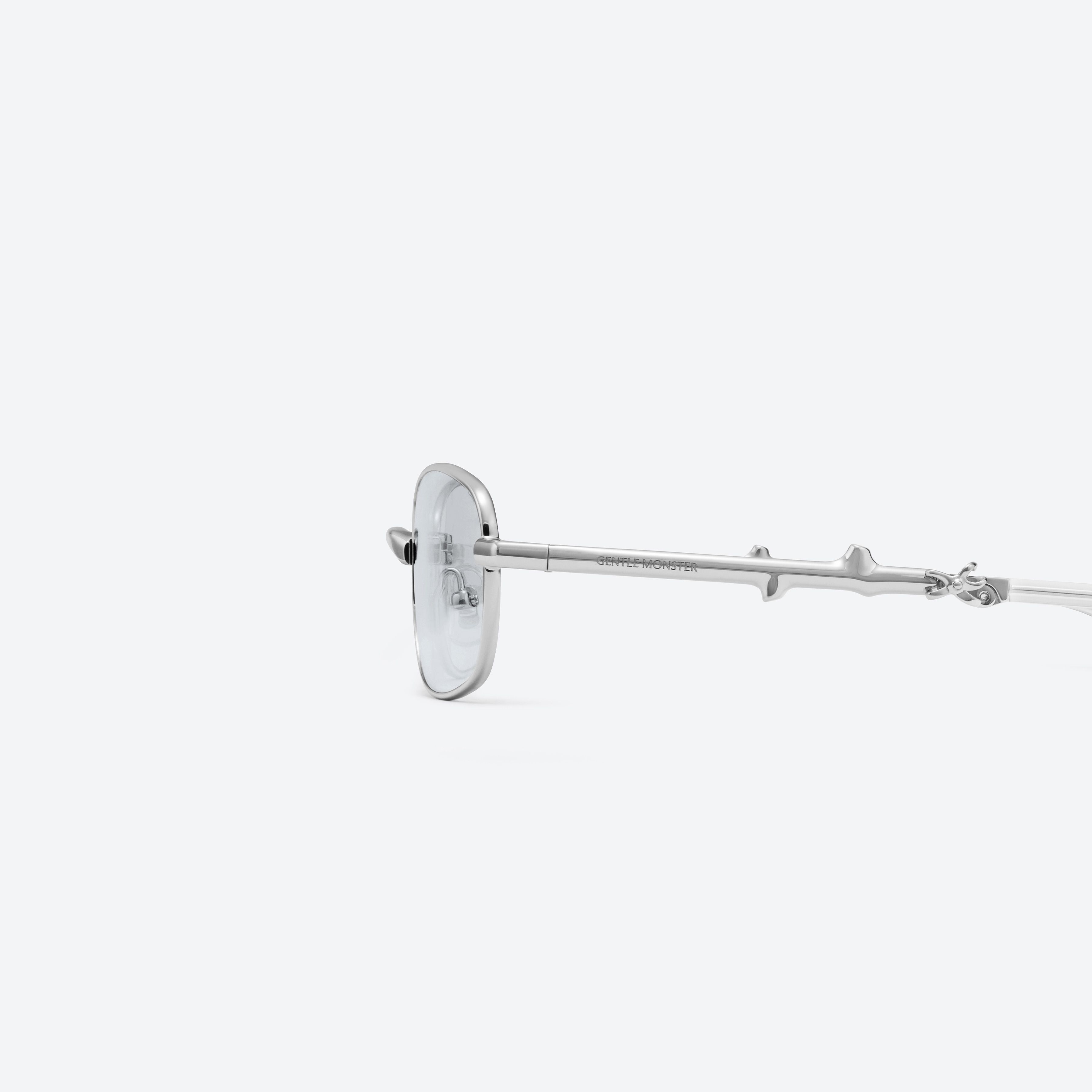 A detailed left view of Gentle Monster Mori 02(GR) Silver Metal framed Square sunglasses.