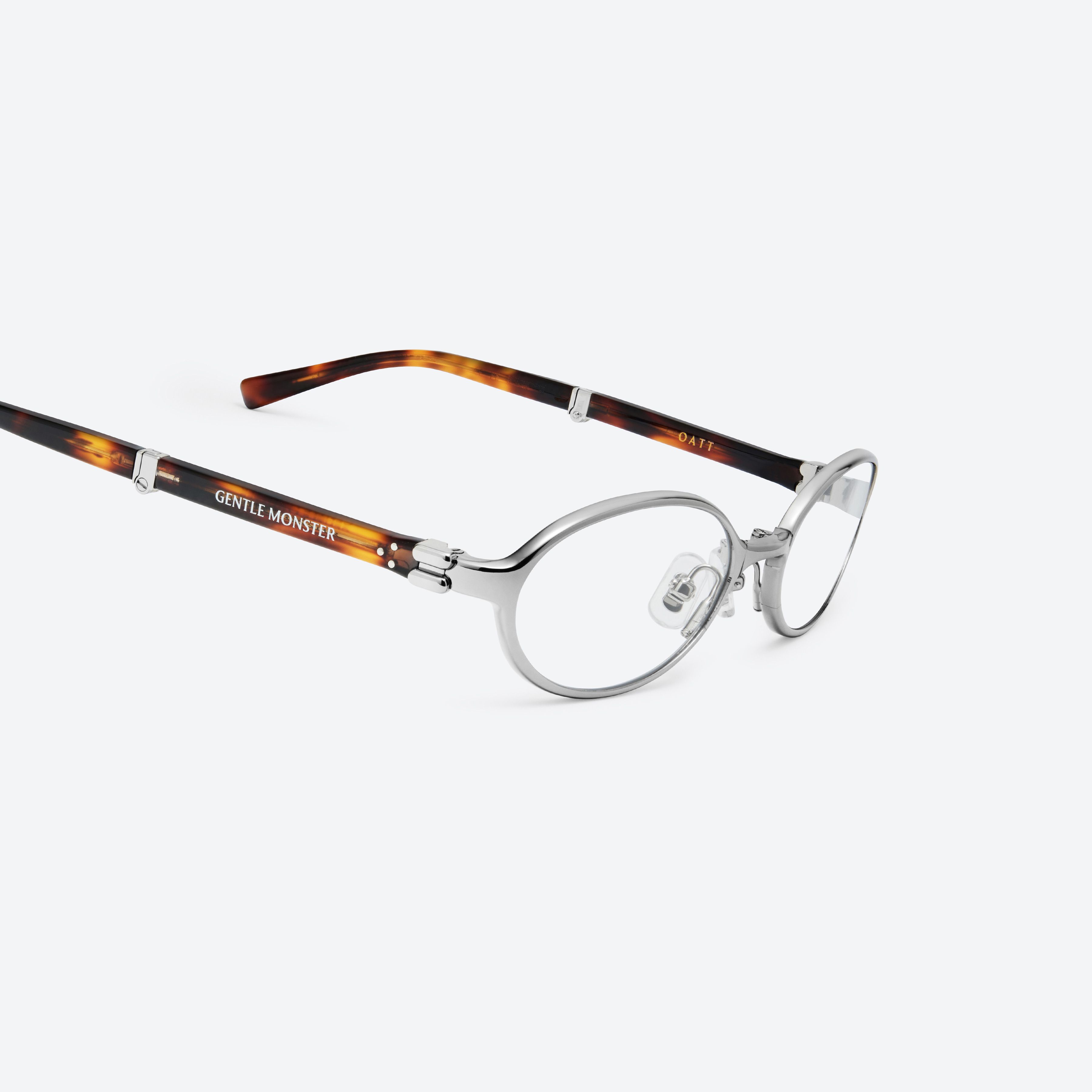 45-degree detailed view of Gentle Monster Oatt 02(C) Silver Mixed framed Oval glasses.