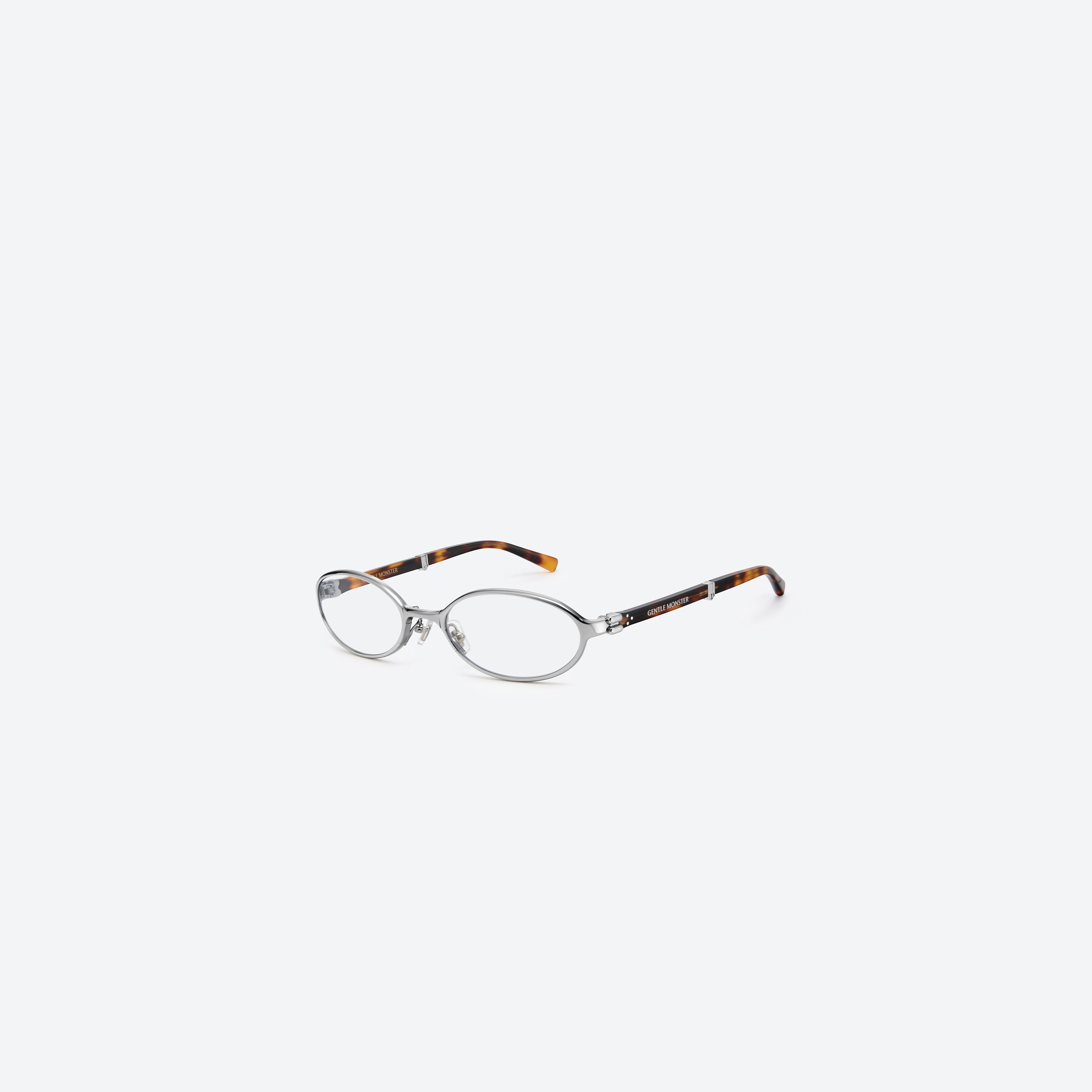 45-degree view of Gentle Monster Oatt 02(C) Silver Mixed framed Oval glasses.