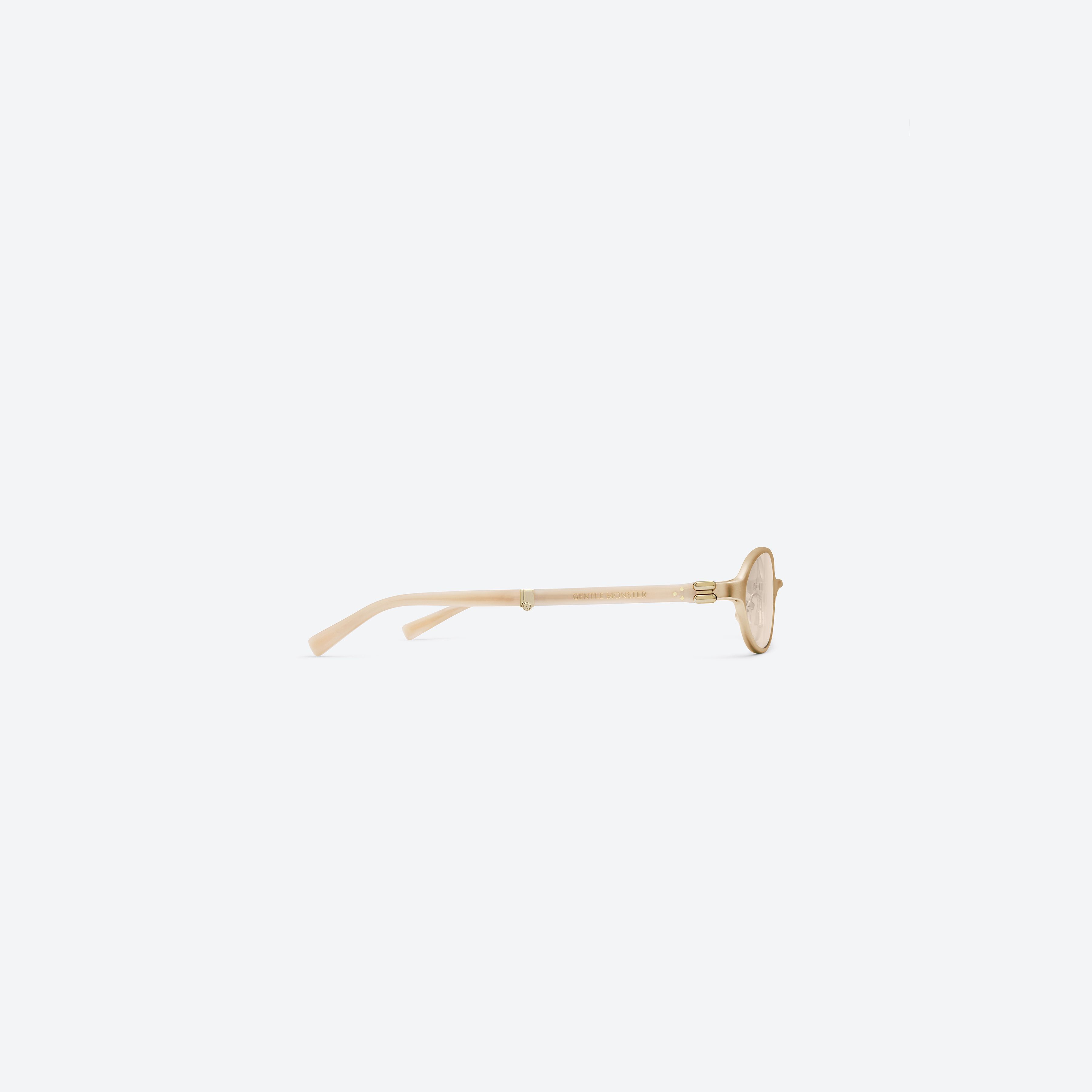 A detailed right view of Gentle Monster Oatt 031 Gold Mixed framed Oval sunglasses.