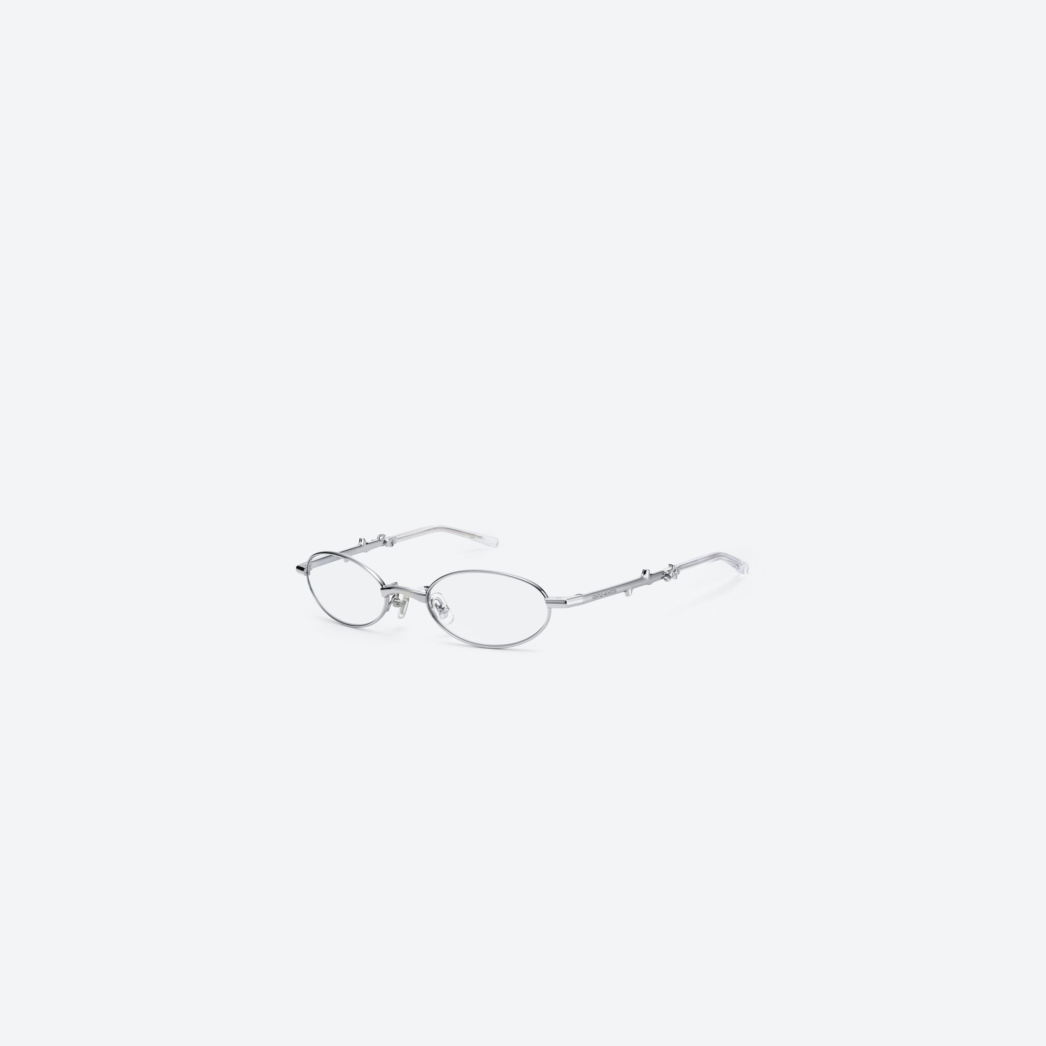 45-degree view of Gentle Monster Radi 02 Silver Metal framed Oval glasses.