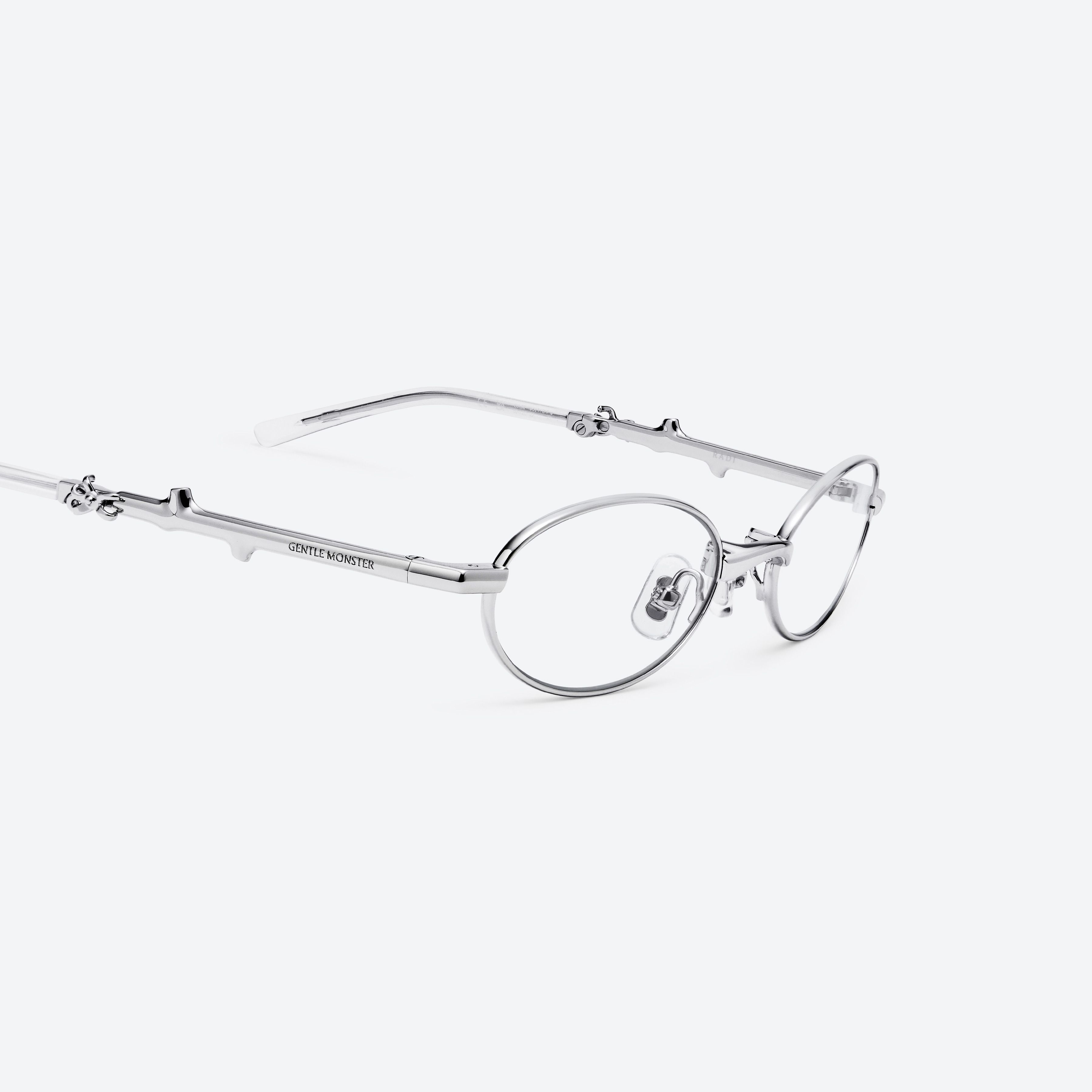 45-degree detailed view of Gentle Monster Radi 02 Silver Metal framed Oval glasses.
