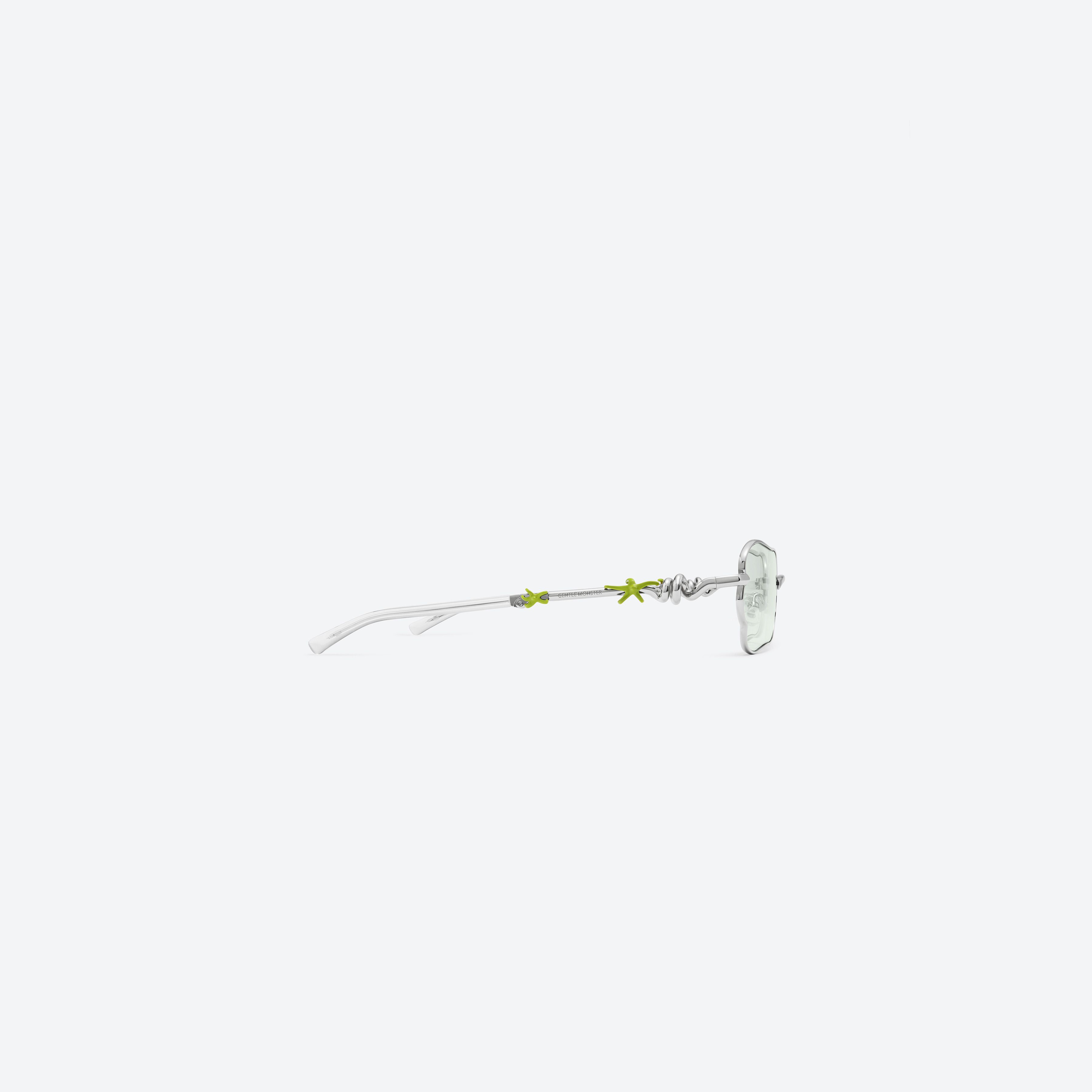 A detailed right view of Gentle Monster Tofi 02 Silver Metal framed Square sunglasses.