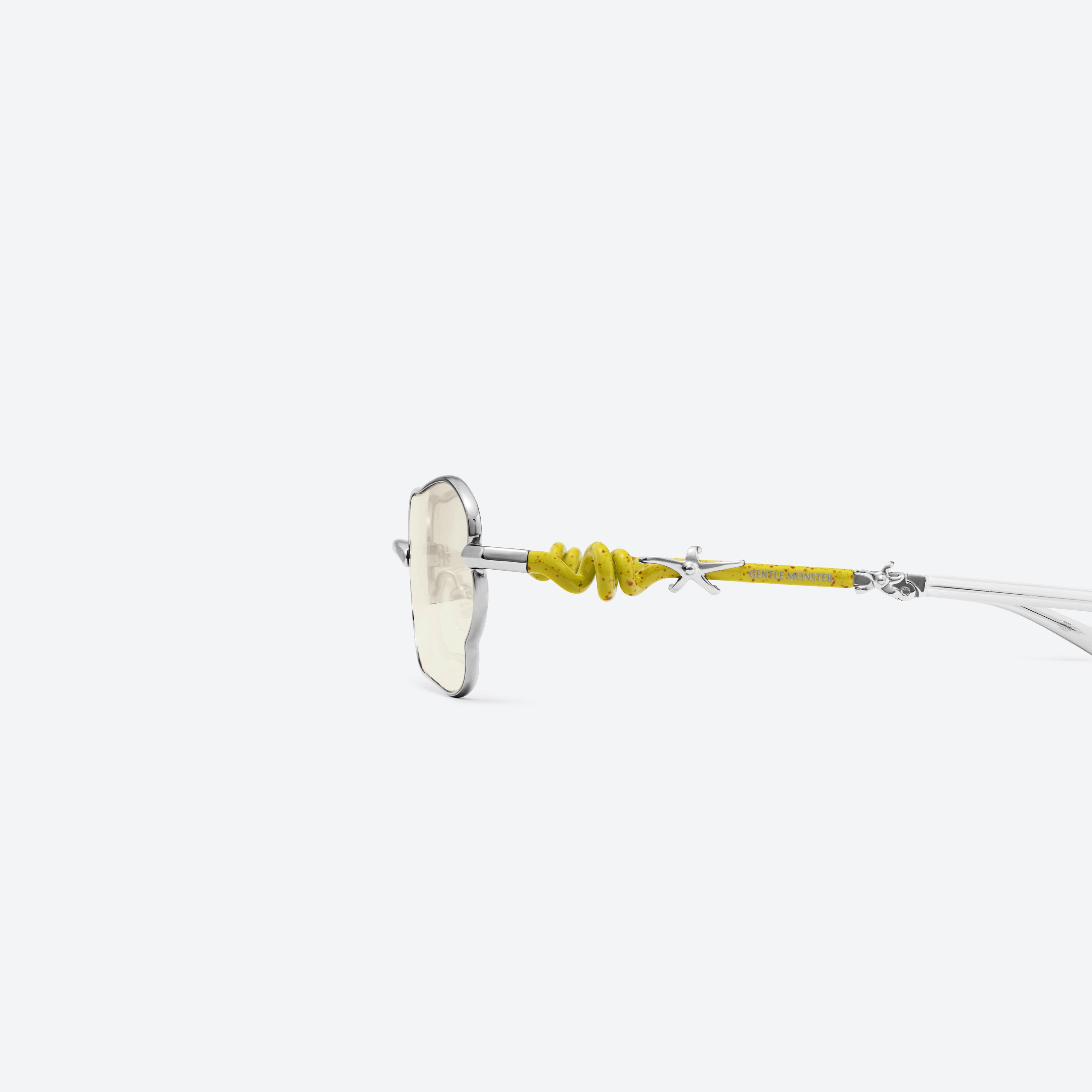 A detailed left view of Gentle Monster Tofi 02(CM) Silver Metal framed Square sunglasses.