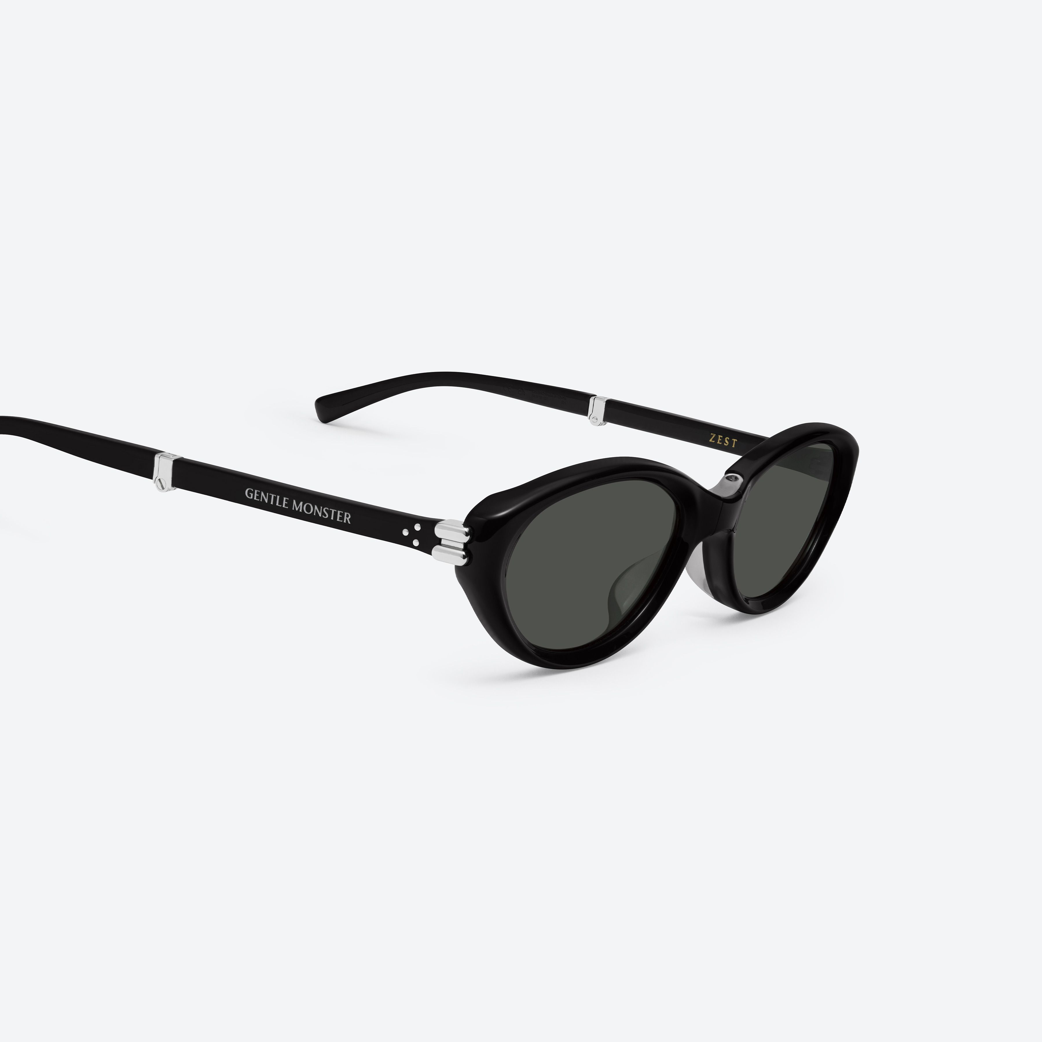 45-degree detailed view of Gentle Monster Zest 01 Black Acetate framed Oval sunglasses.