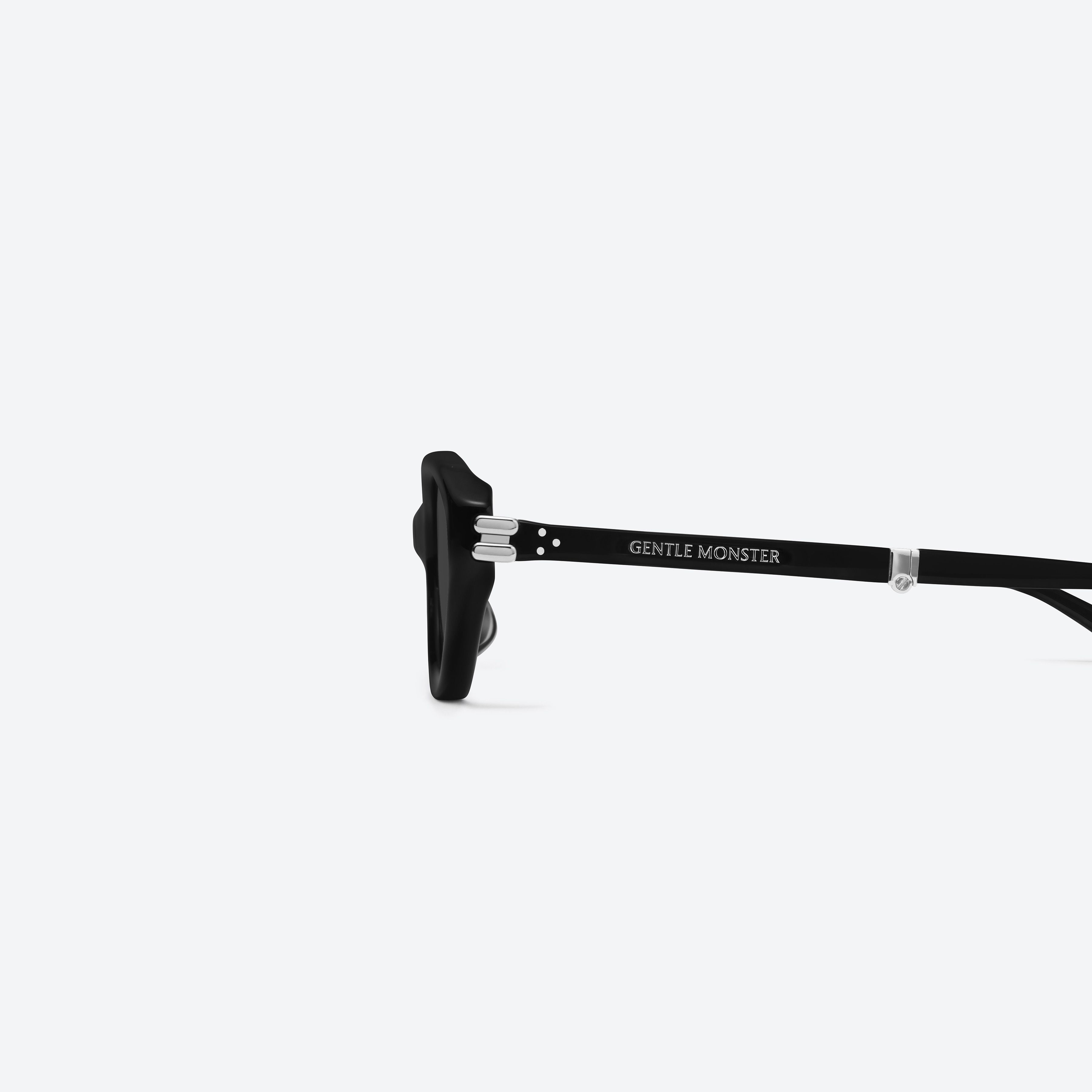 A detailed left view of Gentle Monster Zest 01 Black Acetate framed Oval sunglasses.