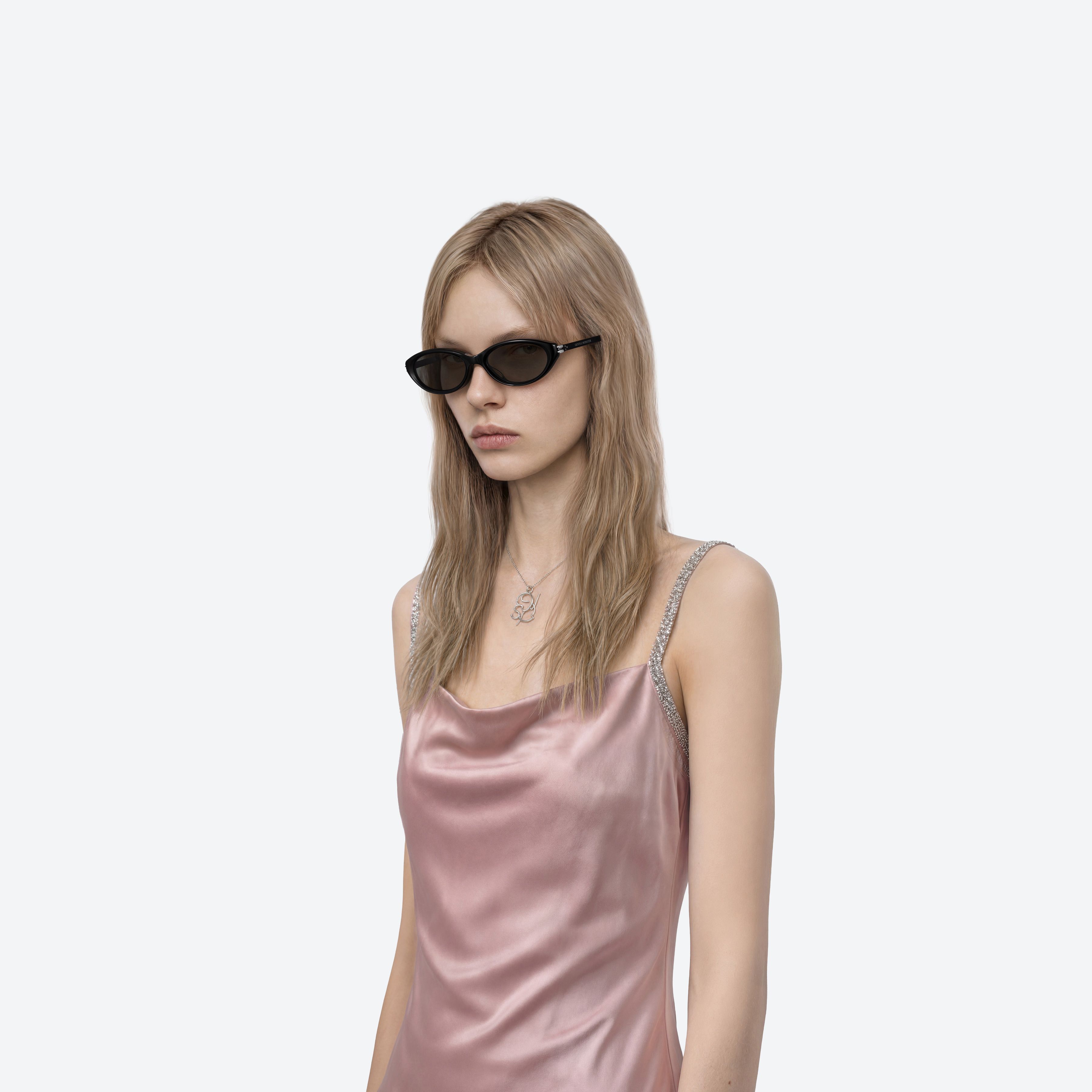 Model wearing the Zest 01 Black Acetate framed Oval sunglasses.