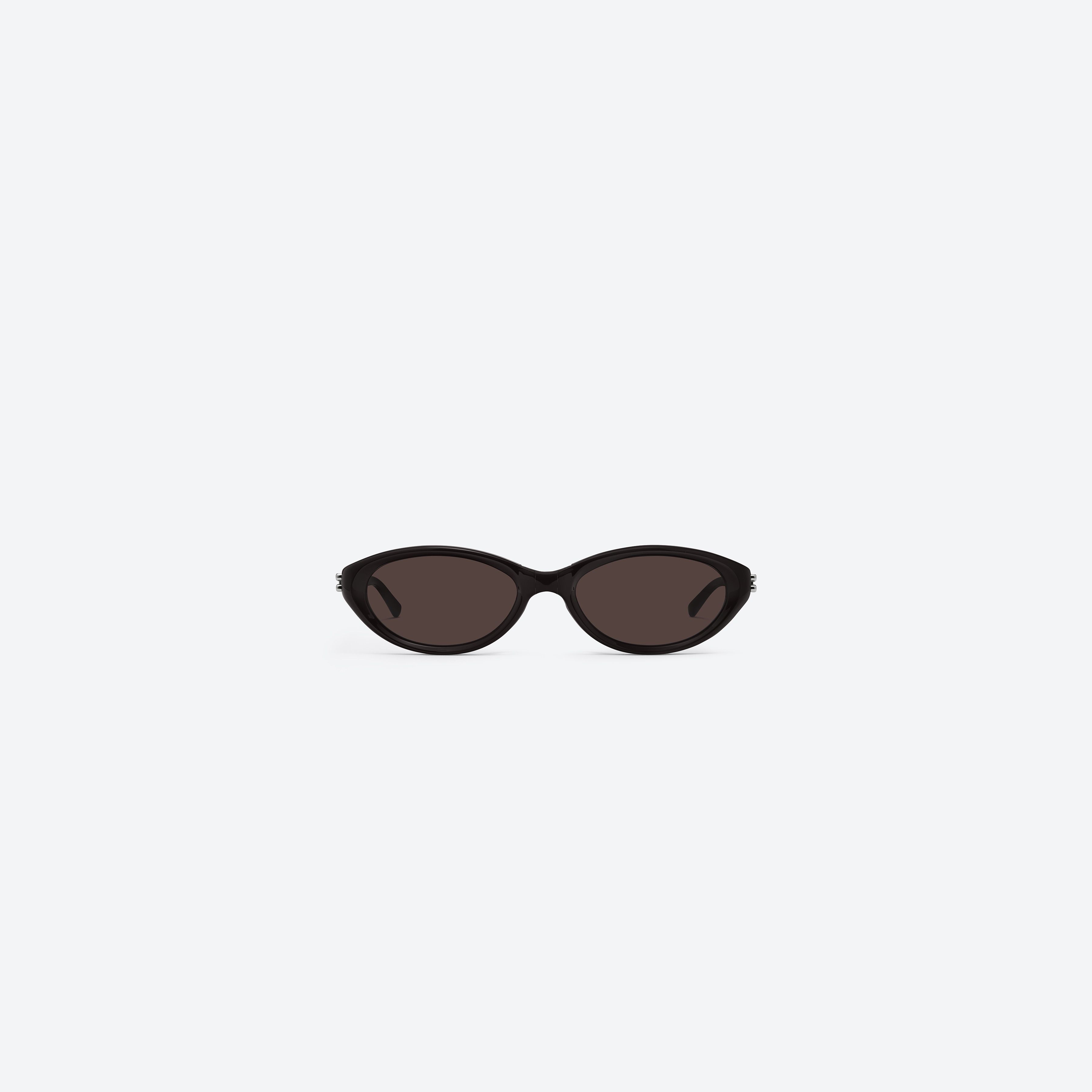 A front view of Gentle Monster Zest BR2 Brown Acetate framed Oval sunglasses.