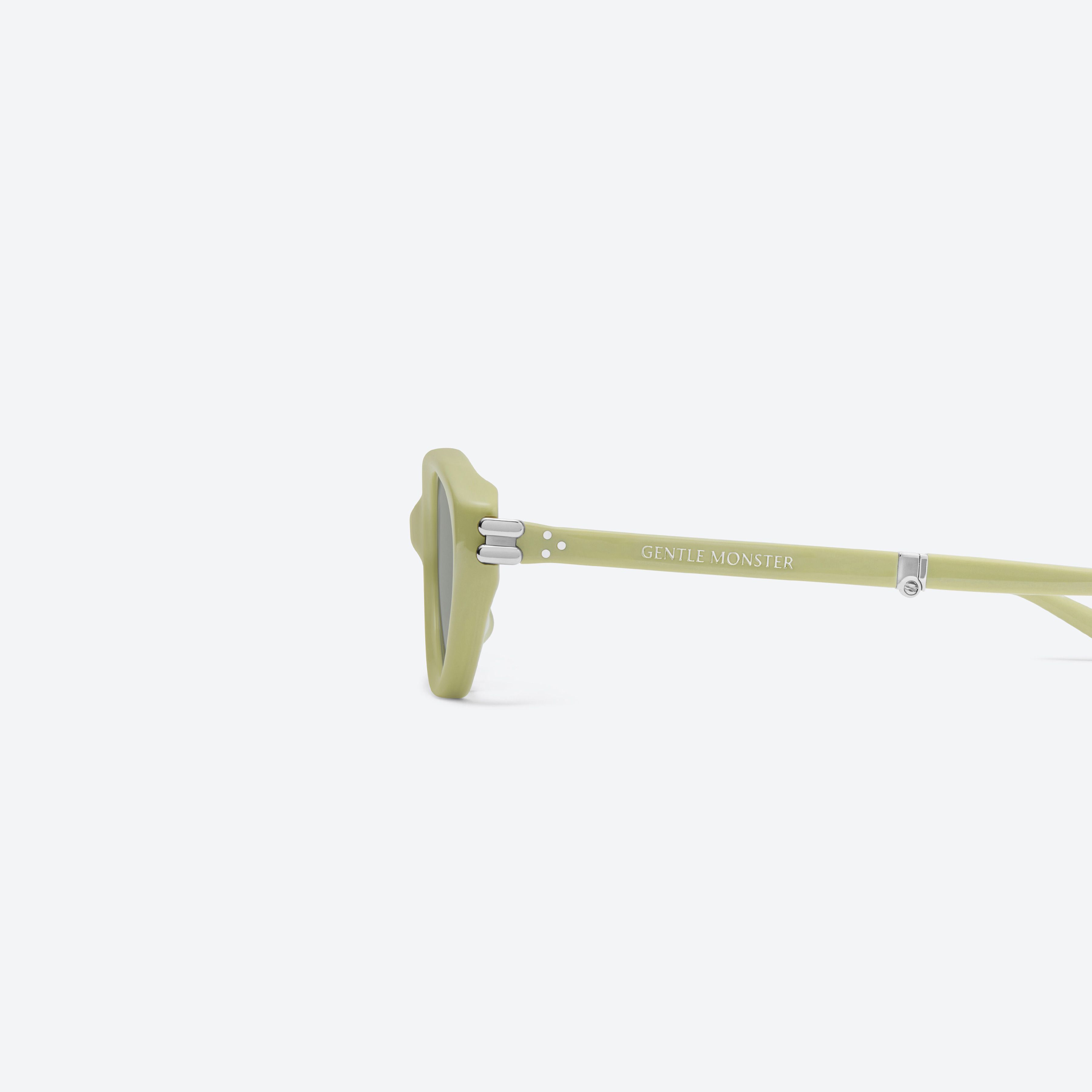 A detailed left view of Gentle Monster Zest GR9 Green Acetate framed Oval sunglasses.