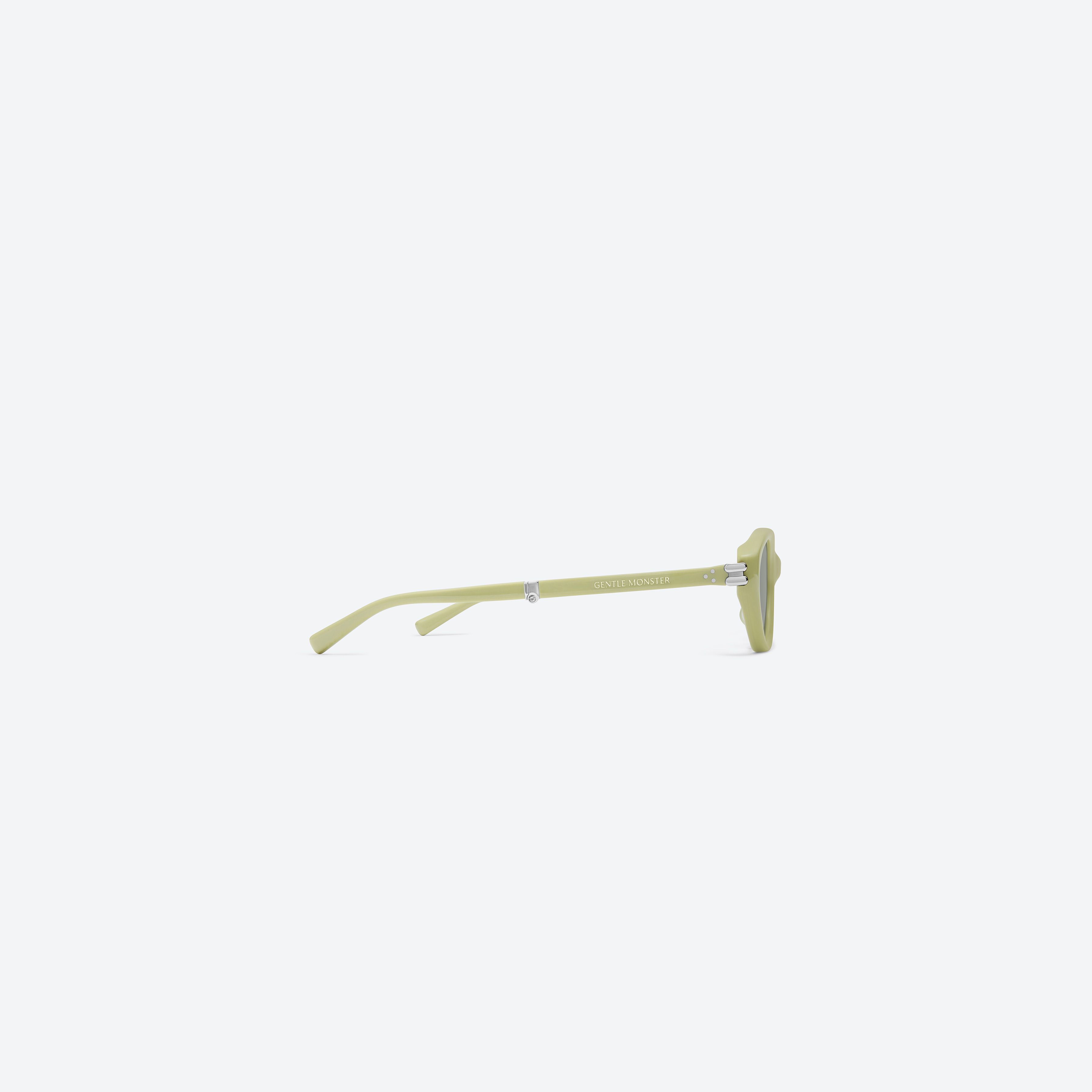 A detailed right view of Gentle Monster Zest GR9 Green Acetate framed Oval sunglasses.