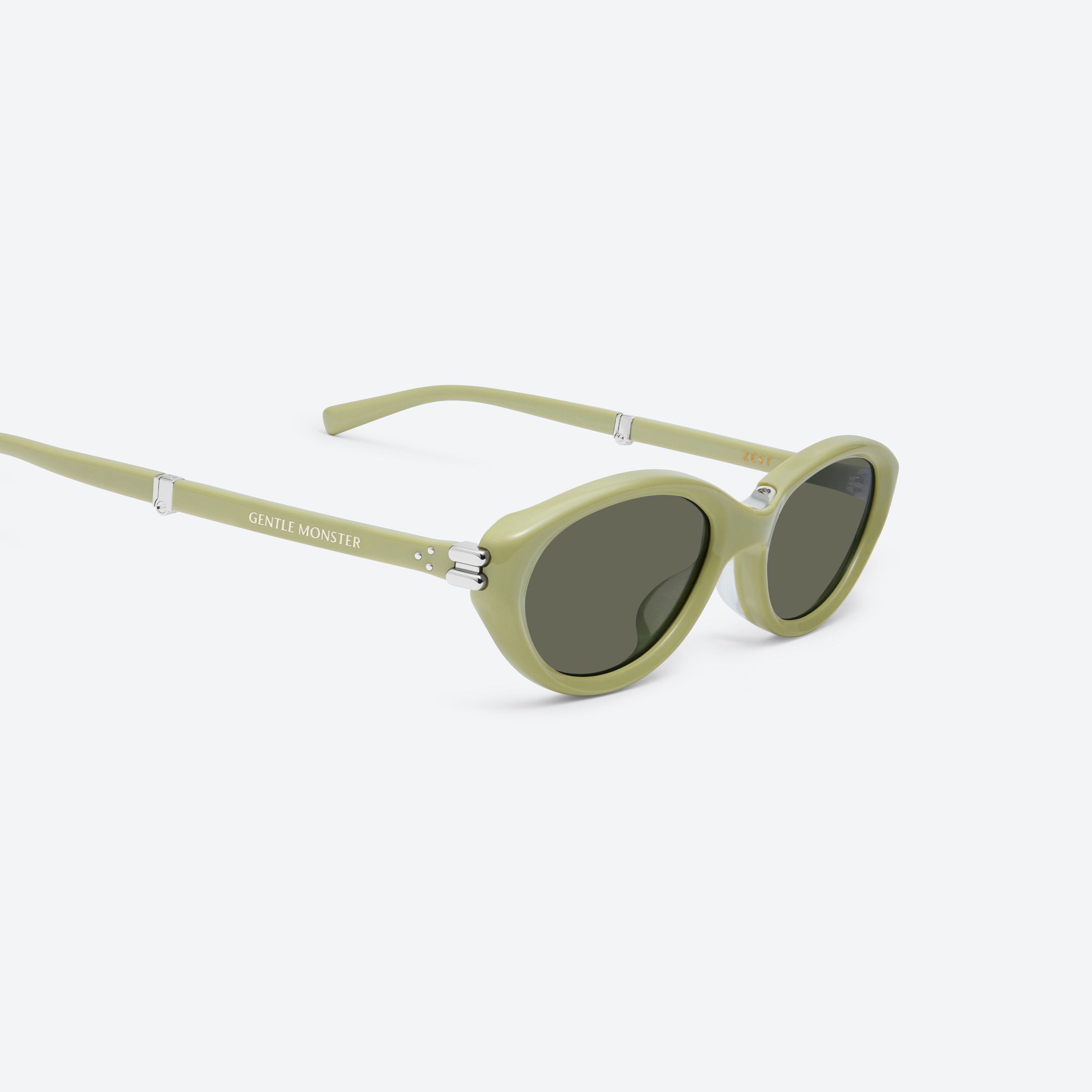 45-degree detailed view of Gentle Monster Zest GR9 Green Acetate framed Oval sunglasses.