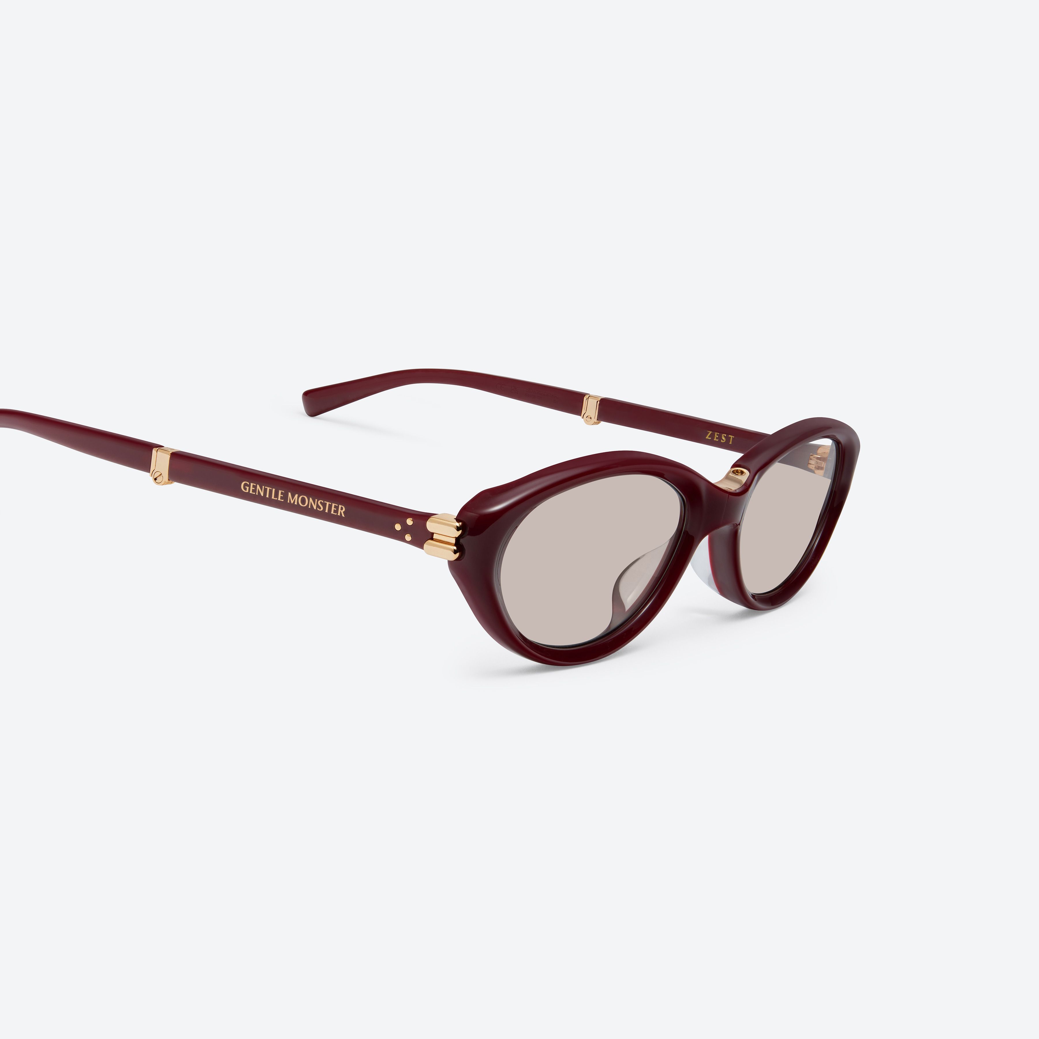 45-degree detailed view of Gentle Monster Zest R8 Red Acetate framed Oval sunglasses.
