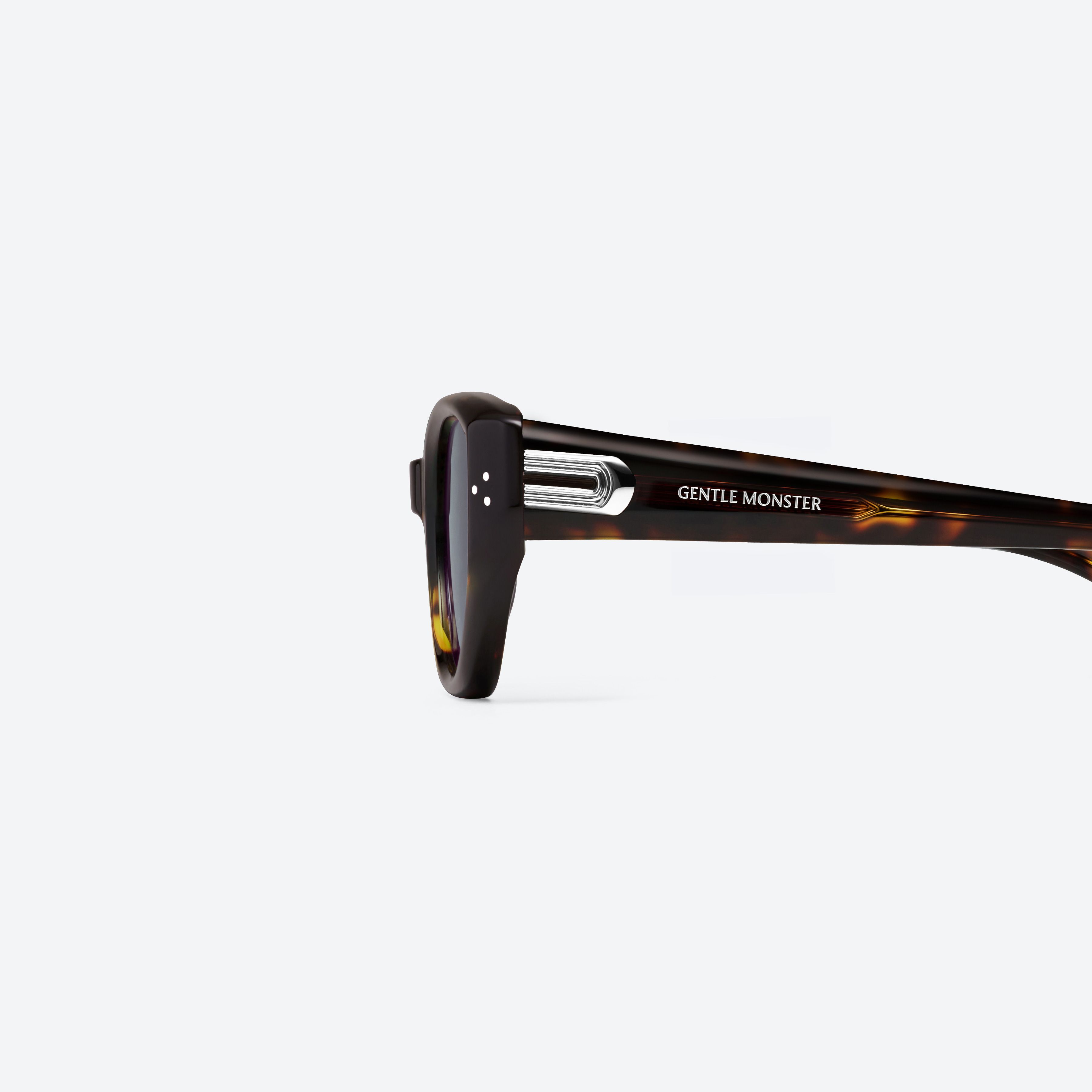 A detailed left view of Gentle Monster Boni T9(G) Tortoise Acetate framed Cat-eye sunglasses.